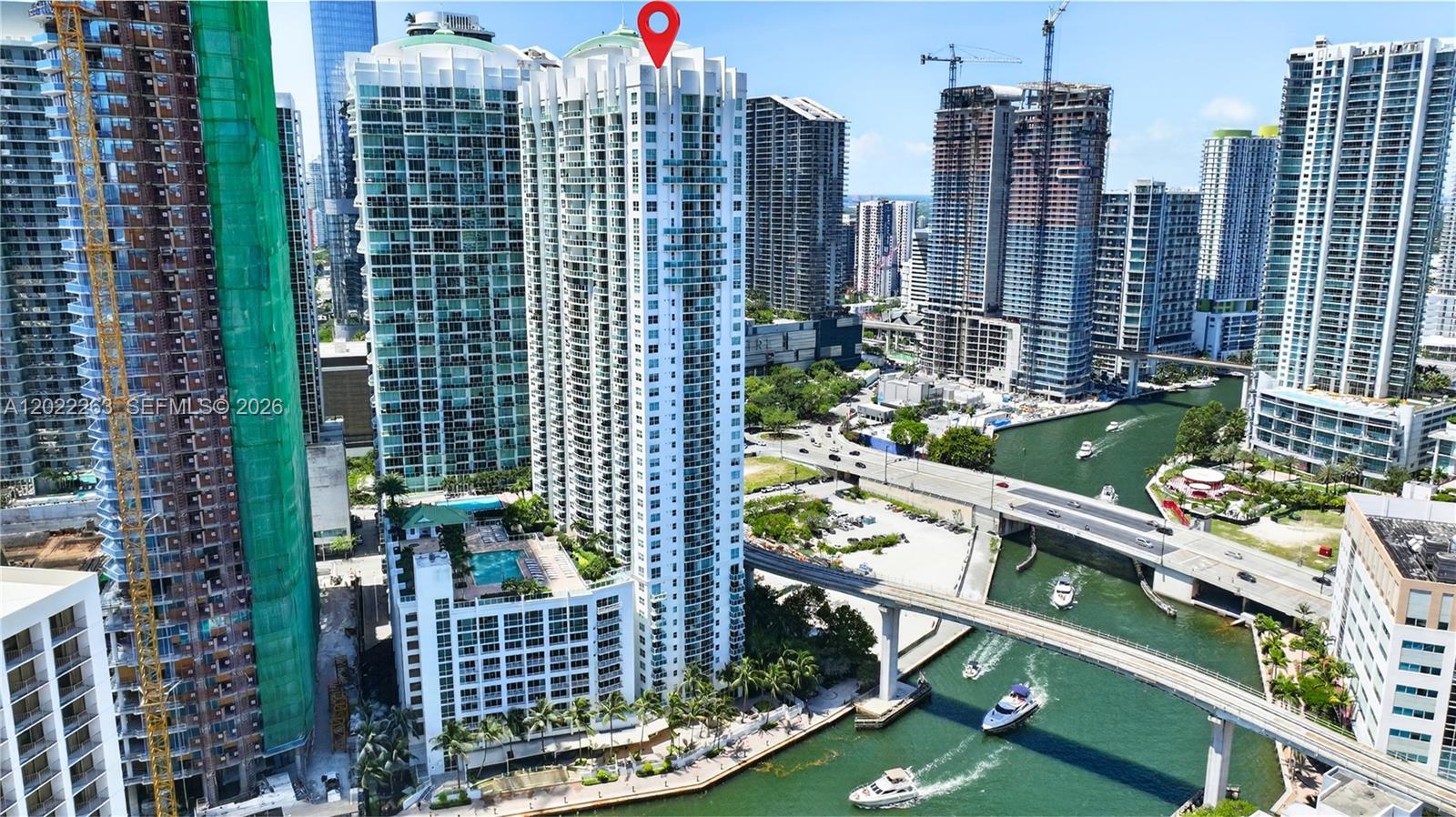 Welcome to Brickell on the River North, perfectly located in the heart of Brickell along the Miami River and just moments from Brickell City Centre, dining, shopping, cafés, nightlife, the Riverwalk, and only steps from the Metromover stop. This well-maintained 1-bedroom, 1-bath residence offers 757 square feet of comfortable living space and a rare second-floor location with everyday convenience that sets it apart.

Unit 203 allows you to skip the elevator and walk directly to your assigned parking space on the same level, making groceries, moving in, and daily errands refreshingly easy. The second floor also features higher ceilings and taller windows, creating a bright, open feel. Enjoy a private balcony framed by lush trees with glimpses of the Miami River and boats passing by, offering a peaceful green outlook in the middle of Brickell’s urban energy.

Brickell on the River North is a well-managed, amenity-rich, pet-friendly building with 24-hour concierge and security, valet and self-parking, fitness center, sauna, steam room, business center, club room, pool, and more. A rare blend of location, lifestyle, convenience, and calm in the heart of Miami. Set up your private showing today!