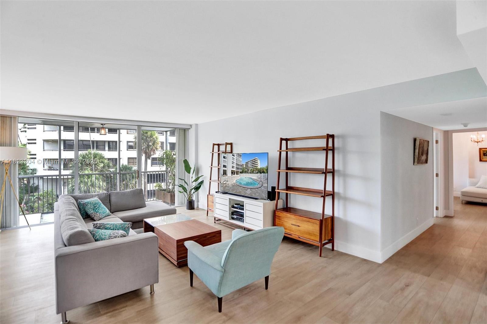 This unit has it all—fully renovated with high-end finishes and timeless neutral tones. Porcelain tile flooring flows throughout, complementing a modern kitchen with ample storage and brand-new appliances. Enjoy well-appointed bathrooms, generous closet space, and a soothing balcony view. Nestled in a charming boutique building featuring a pool, gym, storage, and a community room, all meticulously maintained. Just a short stroll to shops, restaurants, and the beach—this is coastal living at its best.