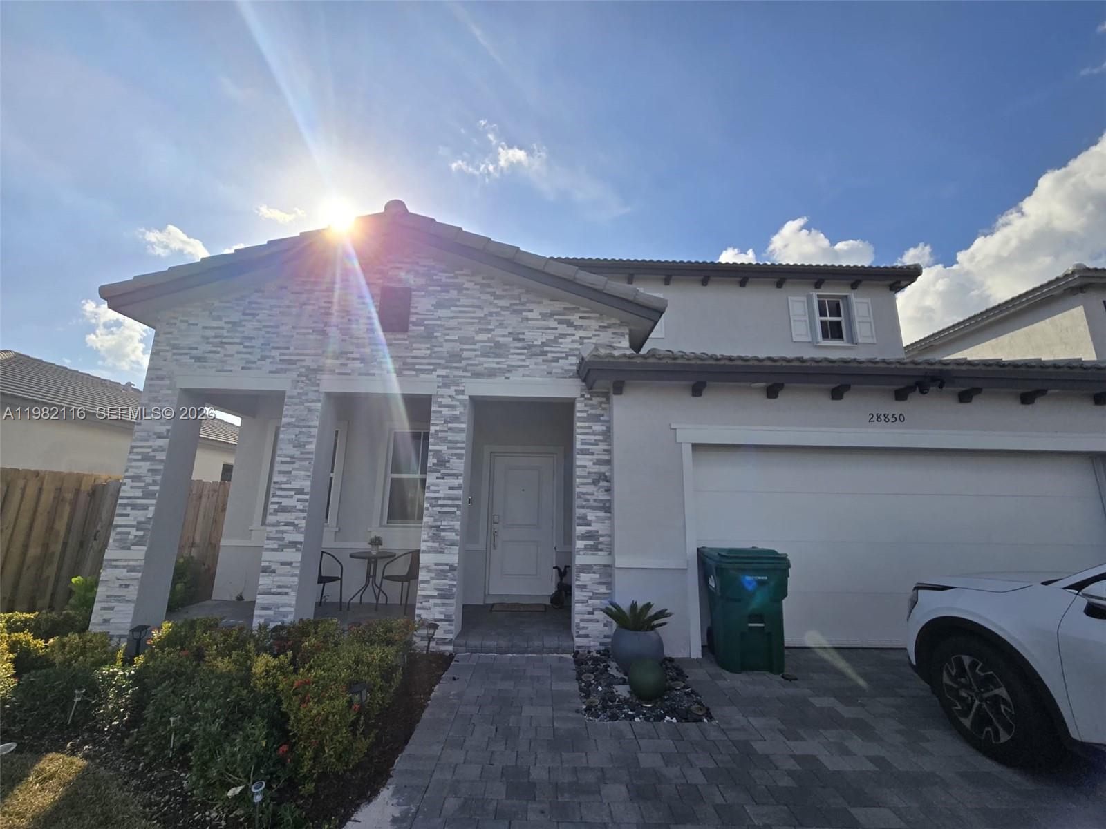 Discover comfort, style, and versatility in this exceptional property. Beautiful two-story home located in a desirable Homestead community featuring a clubhouse and surrounded by elegant residential developments. Conveniently situated near the Florida Turnpike, shopping centers, schools, and other key areas of the city. The home offers 4 bedrooms and 3 bathrooms with a modern open-concept layout, abundant natural light, and spacious private rooms. The kitchen features a center island with decorative wood panel detailing, perfect for cooking and entertaining. The family room showcases a stylish accent wall, and a decorative living room cabinet that will remain with the property. Elegant window treatments are also included. The property also features two additional private spaces thoughtfully designed for guests or extended family, providing added comfort and flexibility. One of these areas includes an elegant kitchenette, refrigeration, a private bathroom, and an independent entrance, making it ideal for visitors, relatives, or flexible living arrangements. The home is equipped with a security camera system that will remain with the property. The backyard offers a large lot with plenty of potential to create a family entertainment area, barbecue space, or even a future pool. It also includes a portable storage shed for additional storage. A perfect blend of comfort, flexibility, and location—schedule your private showing today and experience everything this home has to offer.