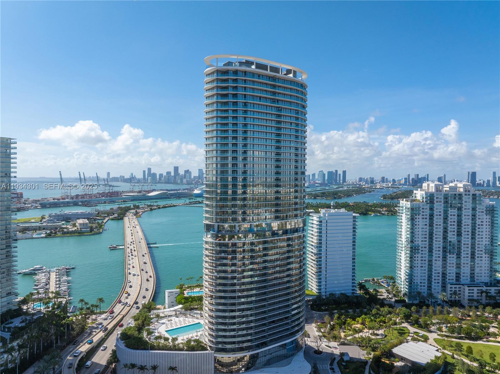 Discover this beautifully appointed 2-bedroom, 2 full bath + powder room residence at Five Park Miami Beach, the iconic new luxury tower redefining the skyline as the gateway to Miami Beach.
Residence 1602 offers an expansive layout with 1,357 SQFT of interior living space and a remarkable 279 SQFT private terrace, providing panoramic views of Miami Beach and the Atlantic Ocean.
The residence is thoughtfully decorated by a renowned interior designer, featuring custom lighting, elegant wallpapers, and a stunning custom dining table, complementing the impeccable design and top-tier finishes throughout. These include Italian oak cabinetry, quartzite countertops, high-end appliances, and soaring 10-foot ceilings that create an open, airy atmosphere.
This exceptional residence boasts floor-to-ceiling windows, a flowing open-concept living and dining area, and a total of 1,636 SQFT of combined indoor and outdoor space.