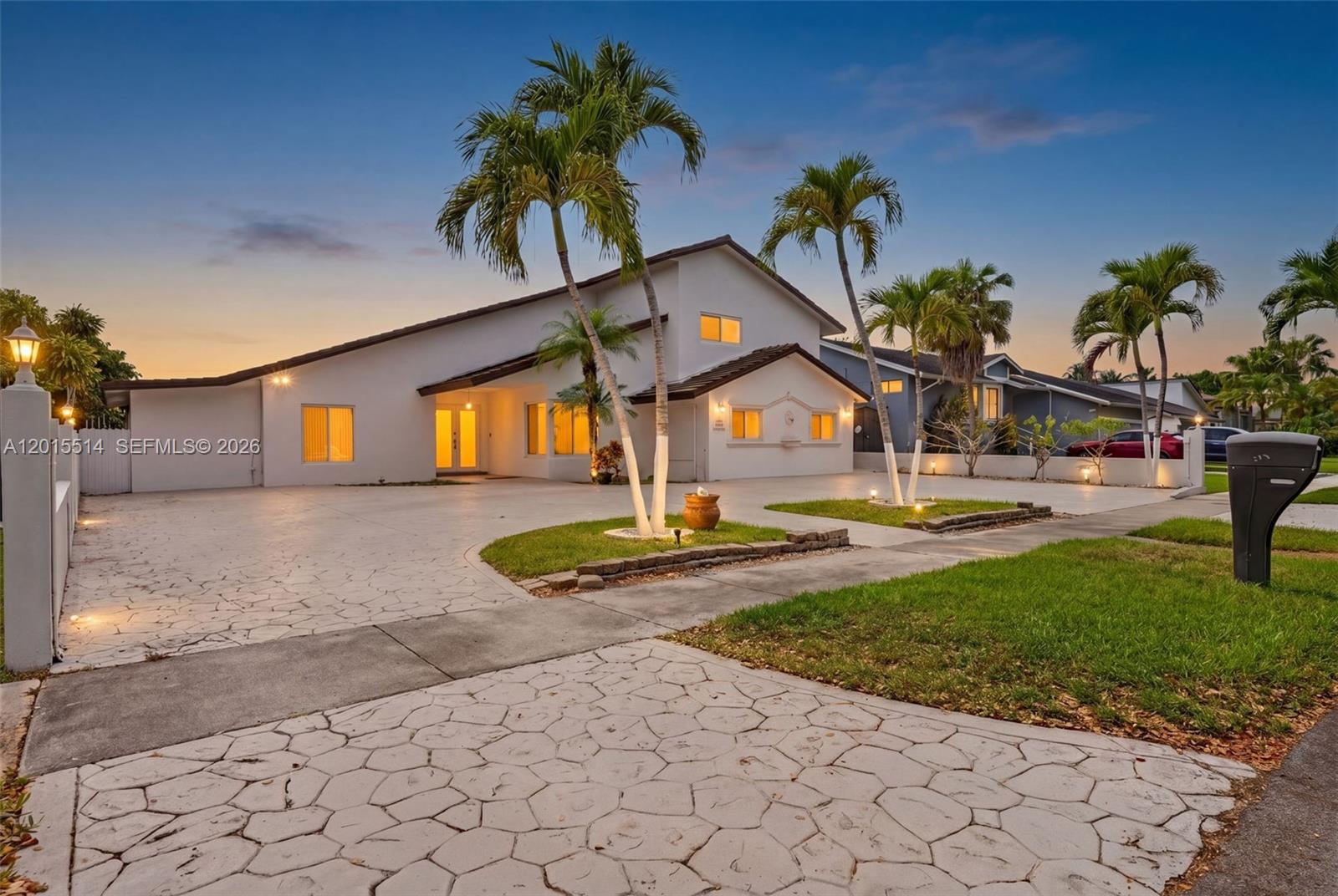 Spacious and beautifully maintained 5-bedroom, 5-bathroom pool home with no HOA! This impressive residence offers a versatile layout featuring 2 bedrooms and 3 full bathrooms downstairs, perfect for guests, in-laws, or a home office setup. Step inside to soaring vaulted wood-beam ceilings, abundant natural light, and expansive living areas designed for both comfort and entertaining. Impact windows and doors throughout the home. The kitchen features wood cabinetry, stainless steel appliances, and ample storage space. Upstairs, enjoy additional bedrooms along with access to a large private balcony overlooking the pool area. The backyard is built for South Florida living with a sparkling pool, spacious patio, and plenty of room to entertain. Oversized circular driveway provides ample parking for multiple vehicles, boat, or RV. Conveniently located near top-rated schools, shopping, dining, and major highways. A rare opportunity with space, flexibility, and no association restrictions!