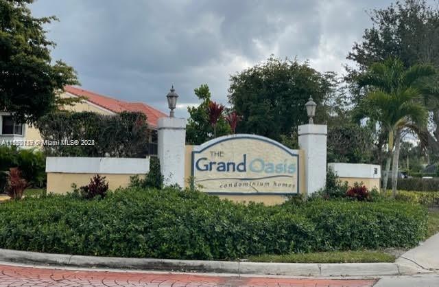 Beautiful, freshly painted and professionally cleaned 1/1 condo at the Grand Oasis in Coral Springs. This apartment features brand new front door, laminated wood floors thorough out, with tile in kitchen and bathroom. White kitchen appliances. Refrigerator w/ice maker. Washer and Dryer inside the unit. Assigned parking spot and plenty of guest parking spaces. This unit is located in a nice, well maintained community, with many amenities which includes: tennis, pool, jacuzzi, BBQs, gym and clubhouse. Water, trash, sewer and amenities are included in the rent. Fabulous location with A+ rated schools, close to shopping plazas and easy access to major highways. This is a must see! It will not last!