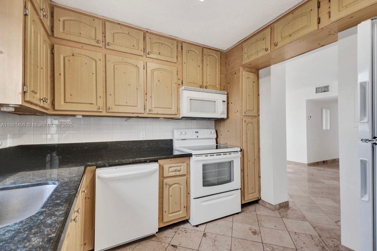 Motivated seller; all offers considered: 2-bedroom + DEN, 2-bathroom condo features marble tile throughout and kitchen with granite countertops, ample cabinetry and abundant natural light. Corner unit with a large balcony, overlooking the tranquil canal. Located just minutes from I-95, the Palmetto Expressway, the Turnpike, Aventura Mall, the beach, and Oleta River State Park, this residence offers convenience and space. ***Please note that the building is currently undergoing renovations, which include repairs to the unit’s balcony.***