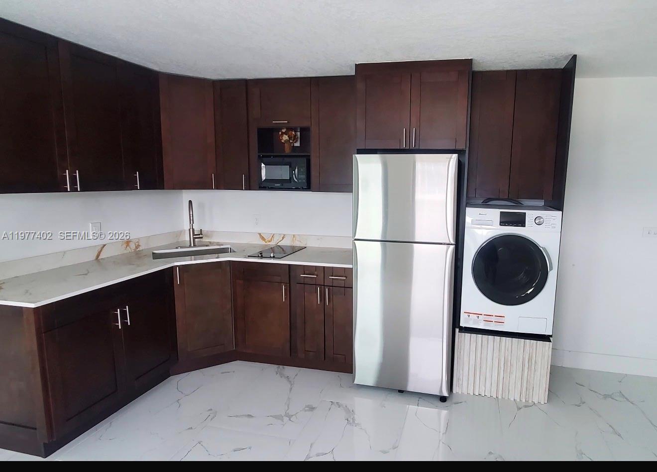 Hialeah Great Location. Beautiful 1 bedroom / 1 bathroom apartment-efficiency in excellent condition located in the heart of Hialeah with easy access to the city. Bright unit attached to a single-family home featuring modern tile flooring, an updated kitchen with wood cabinetry and stainless steel appliances, and an open living area filled with natural light. The bedroom is separate from the main living area offering additional privacy and includes laminate flooring and closet space. The unit features its own private entrance for added privacy and convenient parking available directly in front of the entrance. Utilities included: electricity, water, sewer, garbage, and internet. Close to shopping centers, restaurants, public transportation, and major highways. Easy to show. Washer/dryer inside the unit.