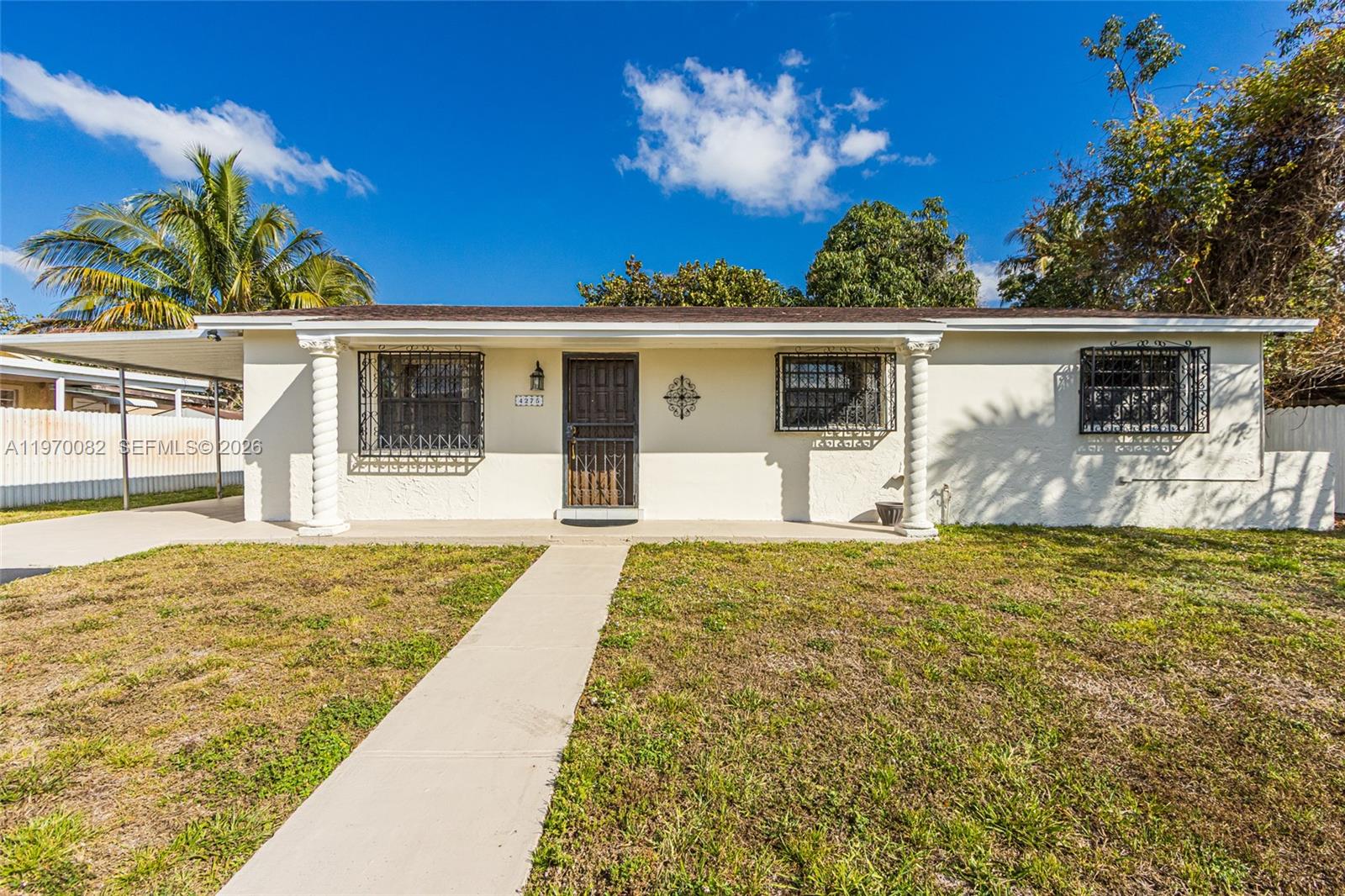 Spacious 3-bedroom, 1-bath home offering two distinct living areas, including a large living room and separate family room for flexible everyday living or entertaining. Improvements include a newer roof (2021), an updated kitchen with modern stainless steel appliances, and a freshly painted exterior.

Situated on an oversized, fully fenced lot with a mature mango tree and plenty of space for a pool, pets, or future expansion. Conveniently located near the Florida Turnpike and Hard Rock Stadium. No HOA.