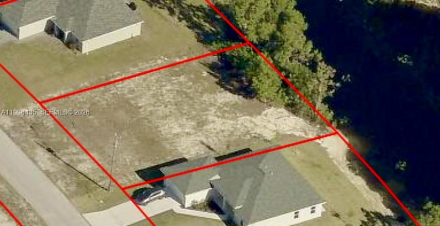 Excellent Opportunity in Cape Coral!  Vacant residential lot located in a growing and highly desirable area of Cape Coral. This property offers the perfect setting to build your dream home or investment property. Key Features: Canal-front lot – enjoy direct water access and beautiful views, Two combined lots (Lots 13 & 14) offering extra space and flexibility,  Quiet and established neighborhood, Ideal for custom home construction or long-term investment

Located in a rapidly developing area with strong appreciation potential, this lot provides the perfect balance of tranquility and convenience. Close to schools, shopping, dining, and main roads. Build your Florida lifestyle here—whether for personal use or investment, waterfront properties like this are always in demand.