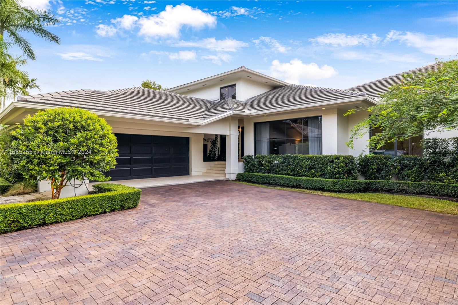 Completely remodeled family residence in sought after Islands of Cocoplum. This home is designed for modern living with an exceptional floor plan. The main level features 4 spacious bedrooms, 3 bathrooms, 2 half baths, while the private upstairs Primary suite boasts a cozy sitting room, expansive closet, and a luxurious bath. Brand-new roof and impact windows and doors. Gorgeous new kitchen and bathrooms, complemented by elegant new floors .The large backyard is an oasis for outdoor entertainment, featuring a sparkling pool, covered terraces, and a spacious patio.  Sited on an expansive 20,000 SF lot.   24 hour roaming security patrol, newly renovated clubhouse w/60 ft. lap pool, playground, gym, 8 clay tennis courts, newly renovated basketball courts, pro beach volleyball court