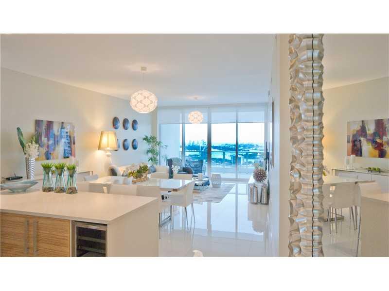 Panoramic views of the bay, ocean and South Beach from this 3 bathroom condo.  Residence boasts a private elevator porcelain floors, California closets and wine fridge.  Paramount Bay amenities include two pools, spa, fitness center, cabanas and much more .  This is a show stopper.