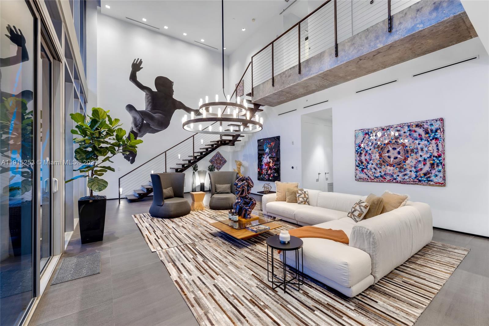 Ático Wynwood is a one-of-a-kind, two-level live/work penthouse with dramatic architecture and iconic  indoor-outdoor living. Featured as an ELLE DECOR Modern Life Concept House, this designer-curated residences is truly exceptional. 2,821 SF of double-height interiors meet ~2,500 SF of private rooftop outdoor space with canopy, bar and skyline views - built for entertaining, living and creating. Set in Wynwood's most artistic live/work building. Ático Wynwood offers rare flexibility as a residence, retreat, or creative compound.