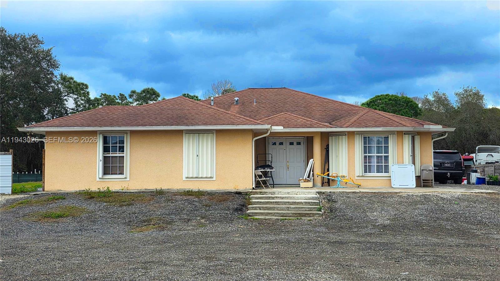 This single-family home, located in Montura Ranch, offers a great opportunity to enjoy space, comfort, and a peaceful lifestyle. Constructed of solid concrete, the property features 4 bedrooms and 3 bathrooms with 1,566 square feet of living area, providing a functional and comfortable layout for everyday living.The 4th Bedroom, is a garage converted into an efficiency apartment. Situated on a 1.09-acre lot, the property offers ample room for outdoor activities, future expansion, gardening, or simply enjoying privacy and open space. This home combines durability, practicality, and land value, making it an excellent option for a primary residence, country retreat, or long-term investment in a quiet Clewiston setting. No HOA, No Fee