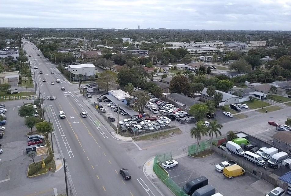 Car Lot with 185 ft of frontage on SW 27th Ave. 1575 Sq Ft Office Building with a fenced lot with dual gates. Property can accommodate 100+/- cars. Current zoning allows for endless development possibilities. See photo renderings. Please contact the listing agent for more information