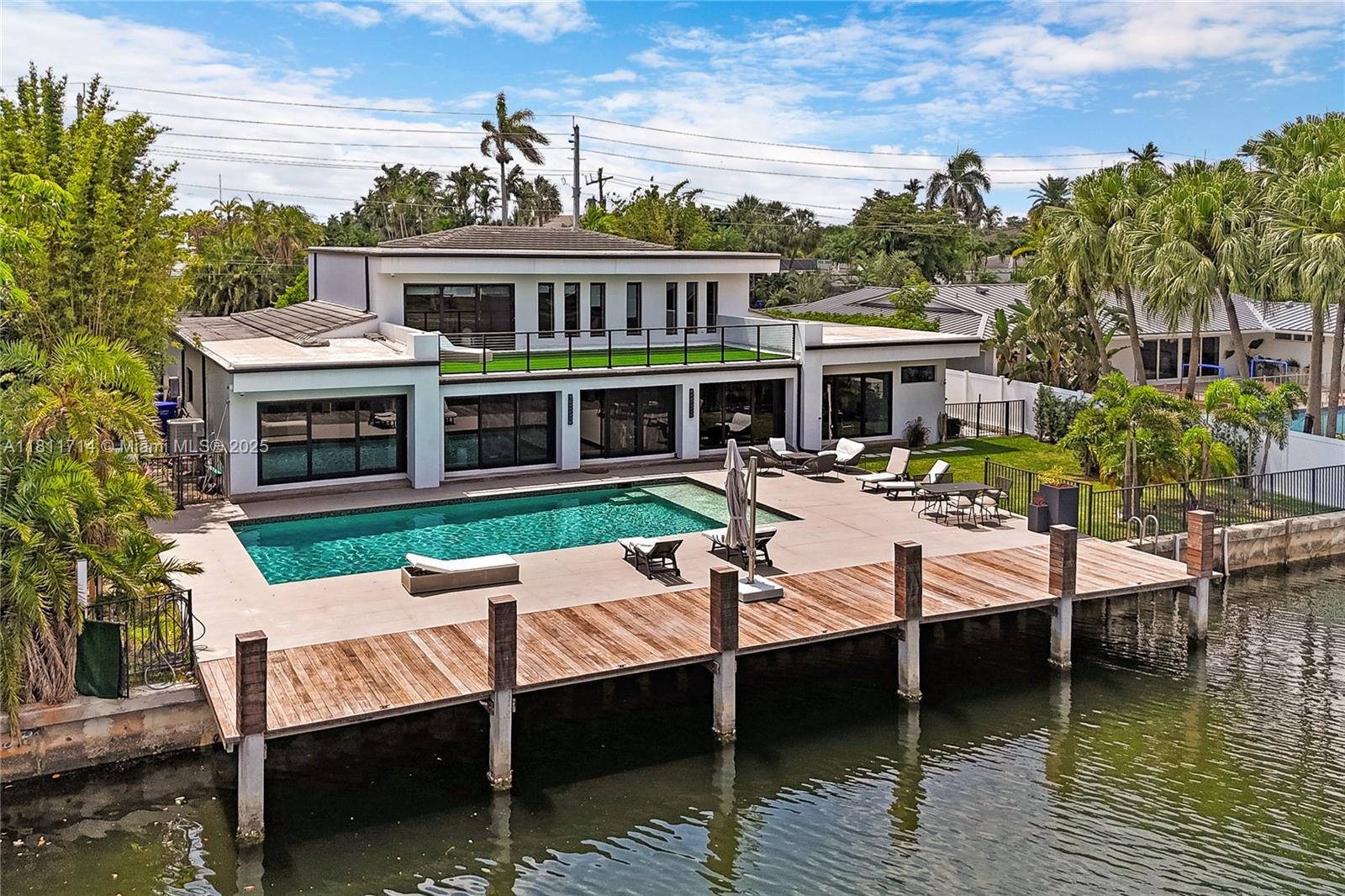 Recently repriced – serious seller! Step into European-inspired beauty and instantly feel the South Florida lifestyle take over. This expanded Diplomat Golf Estates home, renovated in 2015 and refreshed again in 2025, sits on a rare large lot with 80’ of sparkling waterfront and direct ocean access. Enjoy a chef’s kitchen with Sub-Zero/Bosch appliances, a soothing spa-style primary suite with dual closets, gym, and generator. Outside, let resort living sweep you away—heated saltwater pool, jacuzzi, cabana bath, and a private dock ready for your boat. Minutes to beaches, golf, Aventura, and airports.