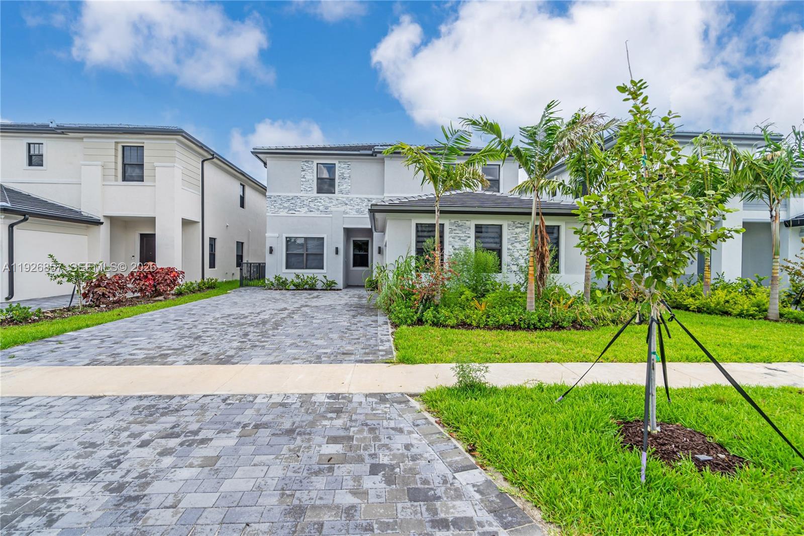 Gorgeous, modern smart home with stunning lake views in the gated community of Marbella. Features 10’ ceilings, open layout, tile on the 1st floor, and a sleek kitchen with island, quartz counters and SS appliances. Upstairs offers elegant vinyl floors, huge master suite with two custom walk-in closets, tub and shower, plus three bedrooms with walk-ins. Enjoy a covered terrace, paved patio, green yard. Includes a private guest suite with kitchenette and laundry. Two-car garage with large driveway. Community clubhouse with gym and pool. Near A-rated schools, Memorial Hospital Miramar, I-75.