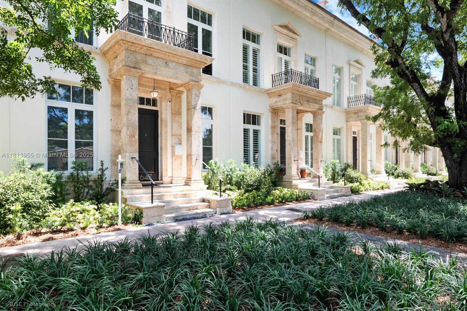 Meticulously redone in 2019, indulge in luxury at the architecturally awarded Almeria ROW ONE, designed by renowned Maria de la Guardia, distinguished by the Row House stone-clad exterior and sky-lit curving staircase, built by Venny Torre, known for excellence. 2019 curated finishes, renovated kitchen w/Sub Zero/Viking appliances, electric blinds, new AV, elevator, and solar panels. Natural light floods the upstairs landing, opening to the primary and Jr. suites, renovated bathrooms, walk-ins. Double doors and a wall of floor to ceiling windows off the kitchen and family room open to the private courtyard retreat with a European pool. Two en-suites, above the detached oversized garage, add to the flexible floor plan. Impeccable, sophisticated, this residence defines upscale urban living.