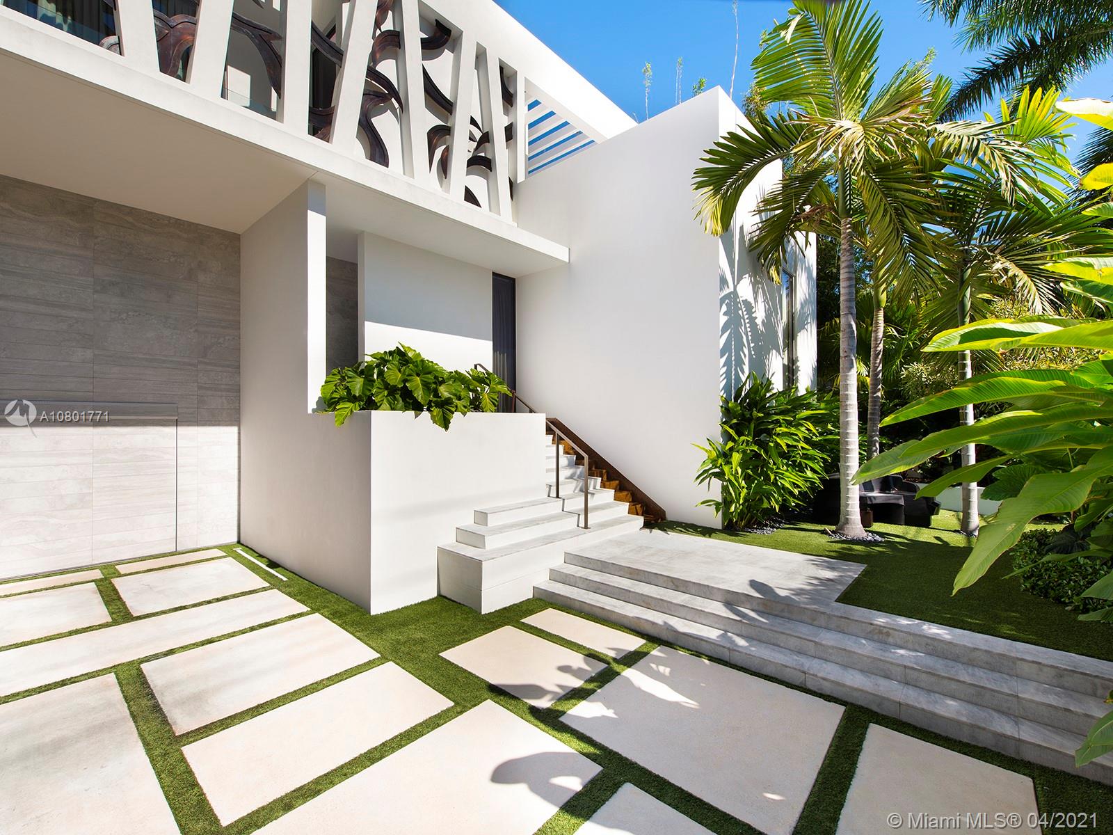 Inspired by a Boheme Design, this marvelous waterfront home sits on an extra-large 12,250 SF lot with spectacular wide bay views to the north including warm, yet modern interiors. This home is truly a form of public art, featuring a living room with vaulted ceilings, a spacious master suite and a large marble bath. Amenities include a large entertaining area surrounding an oversized pool and a new boat dock with lift. Enjoy unobstructed views of Miami and Miami Beach skylines!