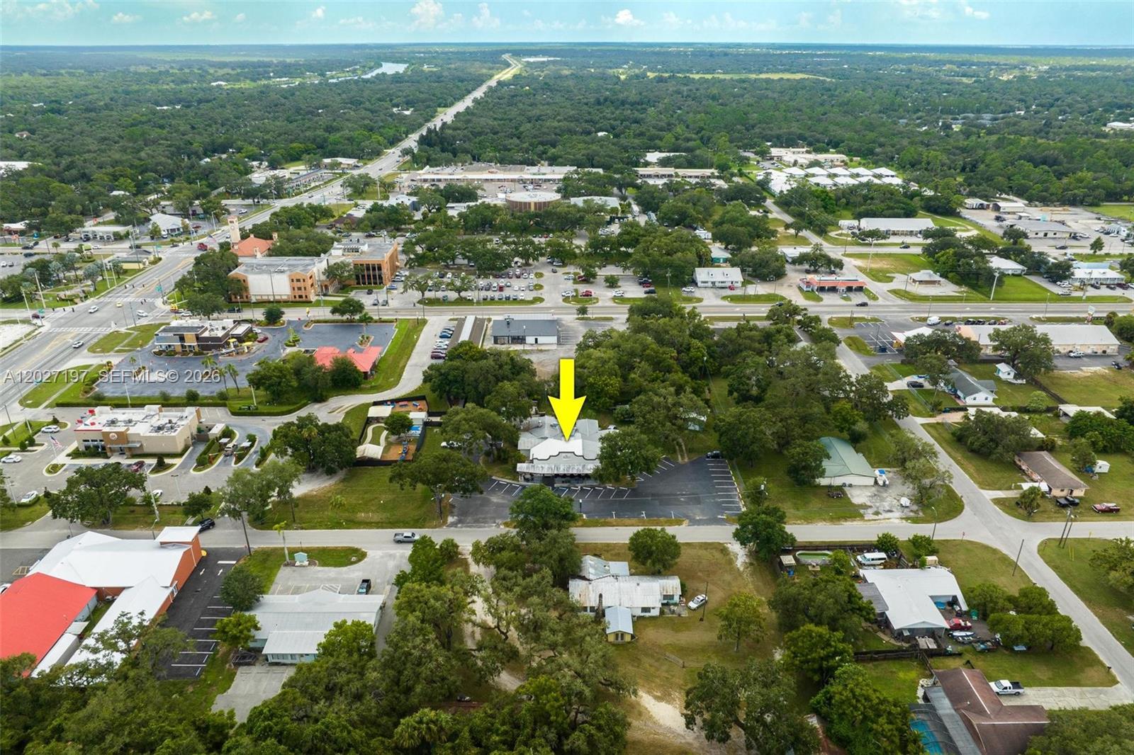 FOR SALE OR LEASE! 4,711+/- SF BUILDING, CURRENTLY SET UP FOR A RESTAURANT AND BAR, BUT FLEX- SPACE THAT COULD HOUSE OFFICES, DAY CARE BUSINESS, ETC., ETC.! Located on 1+ acre with improvements including main building; 1,250+/- SF f full 3/2 apartment for owner, manager, or security; detached private garage; separate screened porch with built-in barbecue building; and storage barn. Property boasts beautiful LaBelle oaks and a huge asphalt paved parking lot along with partial fencing for privacy and security. Main building is concrete block with metal roof, built in 1991 and totally renovated in 2018 and 2021. Restaurant kitchen includes a commercial hood and cooler. There are two 220 outlets under the hood and there’s a freshwater line for pot filling etc. under the hood. The building also features a front canopy patio enclosed by decorative railing and storm shades for outdoor seating and/or entertainment. Restaurant zoned for a 4COP SFS (Special Food Service) Liquor License for beer, wine, and full spirits sold and consumed on premises in conjunction with food service. Located in the heart of downtown LaBelle, a fast-growing bedroom community only 30+/- miles east of Fort Myers. LaBelle has multiple RV parks with shopping and new construction homes being built in this exciting area. Restaurant equipment is not included except for fixtures. Also included are the engineered plans for expansion and outdoor entertainment.