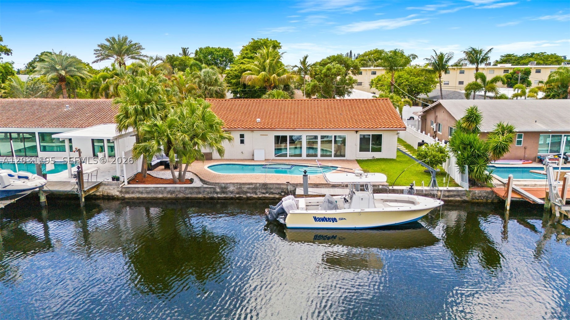 WATERFRONT BOATER'S PARADISE in Snug Harbor – Ocean Access, No HOA, No Rental Restrictions!

Welcome to your dream waterfront retreat in the sought-after Snug Harbor neighborhood of Pompano Beach! This beautifully updated 3-bedroom, 2-bath residence offers ALMOST 2,000 square feet of bright, open living space, featuring Waterfront Kitchen, elegant Porcelain & Bamboo flooring, Granite Counters Tops, Stainless Steel Appliances, WALK-IN CLOSETS abundant natural light, and numerous modern upgrades throughout.

Boating enthusiasts will appreciate the 75 FEET OF WATERFRONT & seawall and 28 FOOT PRIVATE DOCK with DIRECT OCEAN ACCESS and water/electricity. The property is only minutes by boat to Lake Santa Barbara, the Intracoastal & Ocean. Spend your days cruising the waterways and your evenings relaxing poolside while enjoying the serene waterfront setting.

Designed for the ultimate South Florida lifestyle, this home boasts impact windows, extensive updates, and a seamless indoor-outdoor flow perfect for both everyday living and entertaining. The spacious living areas open to a private backyard oasis complete with a sparkling pool, expansive outdoor entertaining space, and tranquil canal views.

With no HOA, no rental restrictions, and an all-ages community, this property offers outstanding flexibility for homeowners, seasonal residents, investors, and Airbnb operators alike. Conveniently located just minutes from the dining, shopping, entertainment, and beautiful beaches surrounding the iconic Pompano Beach Pier, you'll enjoy the perfect balance of peaceful waterfront living and vibrant coastal amenities.

Whether you're searching for a boater's paradise, a profitable vacation rental opportunity, or your forever home in paradise, this exceptional property checks every box. Don't miss this rare opportunity to own a move-in-ready waterfront gem in one of Pompano Beach's most desirable neighborhoods.