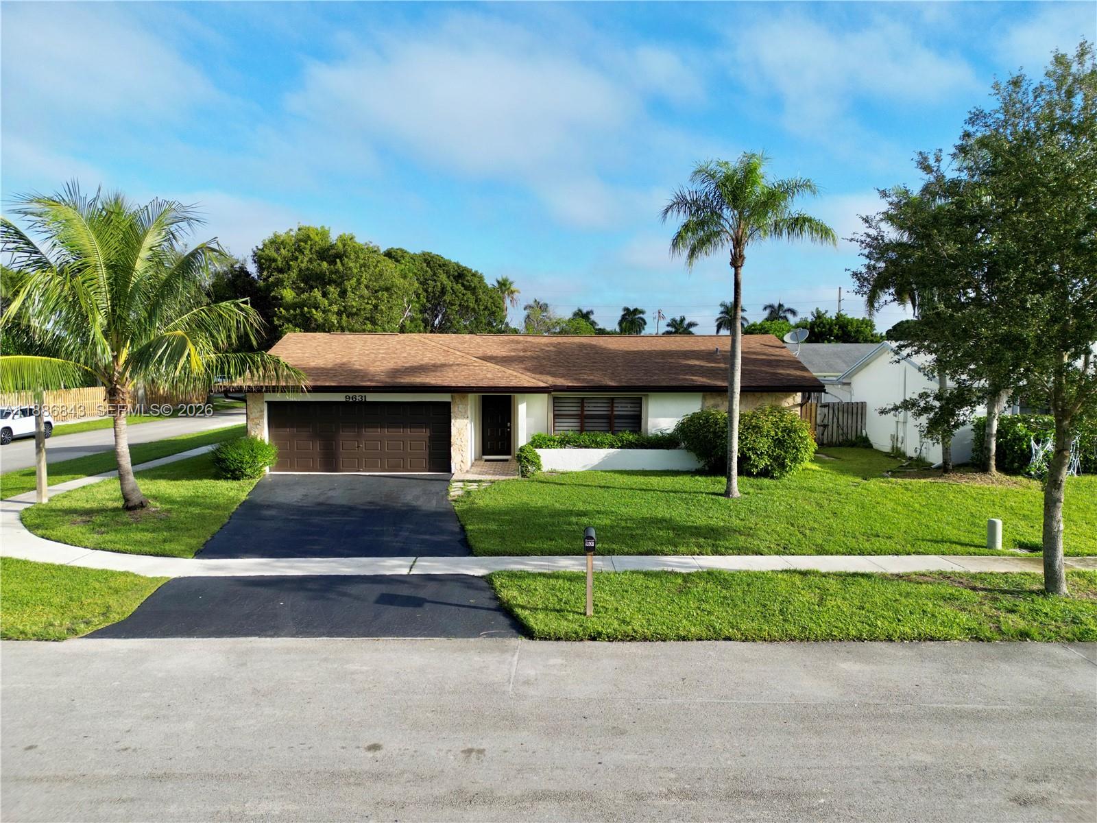 Price Reduced! Spacious 3BR/2BA home in Hills of Welleby offering 2,219 sq ft under air on a 7,266 sq ft corner lot. Roof (2019) and new A/C (2025). Features include impact garage door, hurricane shutters, porcelain tile floors throughout, and a bright open layout. Both bathrooms fully remodeled. Kitchen with granite countertops. Enjoy a beautiful Florida room plus extra flex space ideal for an office, playroom, or TV room, including a separate area next to the primary suite. Freshly painted inside & out, with electric blinds, updated lighting, and modern fans. Prime location near Sawgrass Mills, dining & entertainment, close to Sawgrass Expwy, I-95 & Turnpike, and 20 min to FLL Airport.