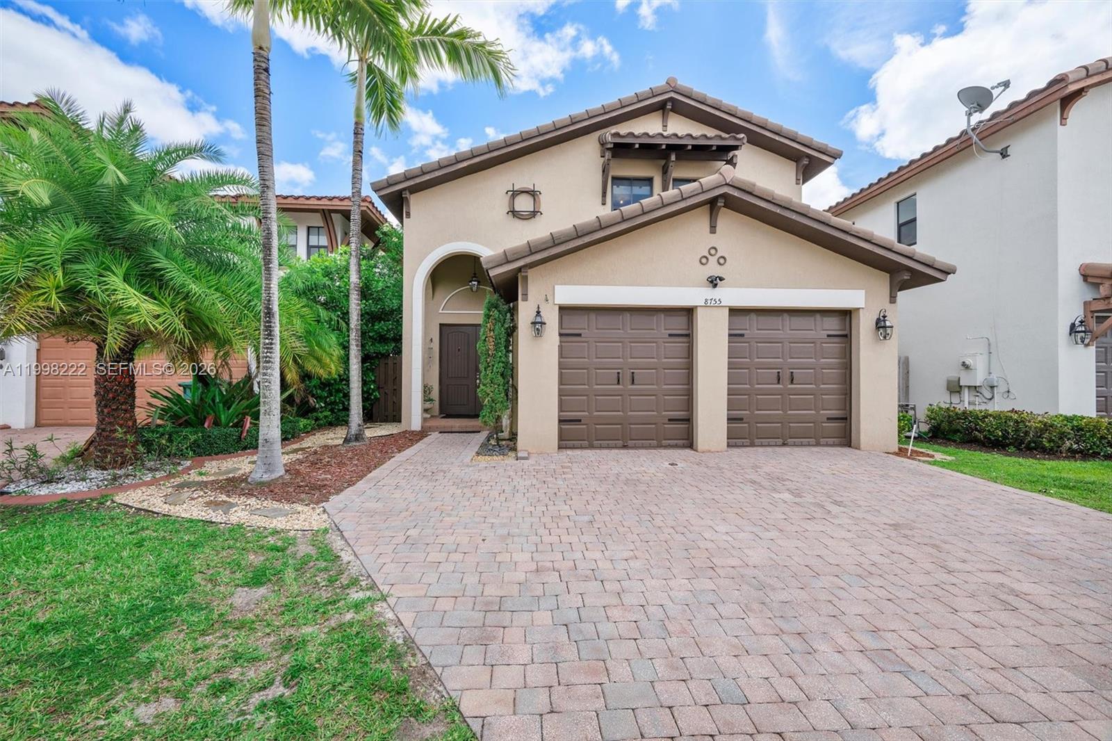 Welcome to your new sanctuary in the sought-after Grand Bay North community. This spacious two-story residence offers a thoughtful layout across 2,462 finished square feet, perfectly blending modern utility with everyday comfort. With 3 beds and 2.5 baths, the home provides ample room for relaxation and productivity alike. The main level flows seamlessly from one living space to the next, highlighted by an abundance of natural light. The heart of the home extends outdoors into a custom-enclosed patio, a significant addition. Protected by a durable metal roof, this versatile space serves as a true extension of the interior, ideal for morning coffee, quiet afternoons, or hosting gatherings regardless of the weather. Main roof is 9-10 years old. Practicality meets style with a two-car garage that provides generous storage and parking. Location is a primary highlight of this property. Residents enjoy close proximity to the vibrant atmosphere of Downtown Doral, where a variety of local dining experiences and boutique shopping await. For those who value outdoor recreation, several nearby parks offer green space and leisure activities. Commuting is made simple with quick access to major highways, while expansive shopping malls are just a short drive away, putting every necessity within reach. This home offers a balanced lifestyle of quiet residential living and urban convenience. Come see the quality and care for yourself.