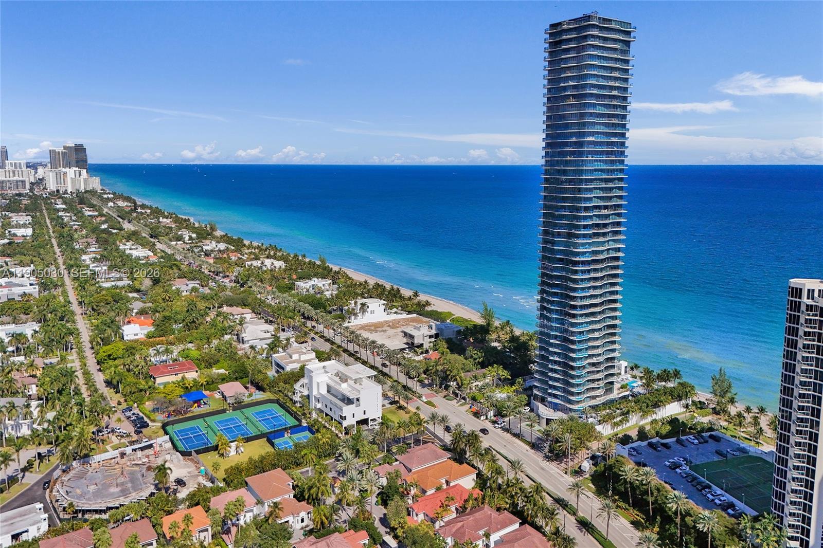Experience unparalleled luxury in this oceanfront residence at the prestigious Regalia Condominium in Sunny Isles Beach, featuring only one unit per floor. Perched on the 16th floor, this expansive 4-bedroom, 5.5-bathroom condo spans 4,992 sq. ft. of refined living space plus wrap-around balcony, featuring floor-to-ceiling windows, marble floors, and breathtaking 360-degree panoramic ocean and City views. Designed for both elegance and comfort, the unit features a private elevator, top-of-the-line appliances, and sophisticated interior touches, including a cooking island, built-ins, and skylight views. Residents enjoy world-class amenities including 24/7 security, resort-style pool, spa, gym and beach service. This is a rare opportunity to own a slice of coastal paradise in one of Miami’s most iconic buildings.