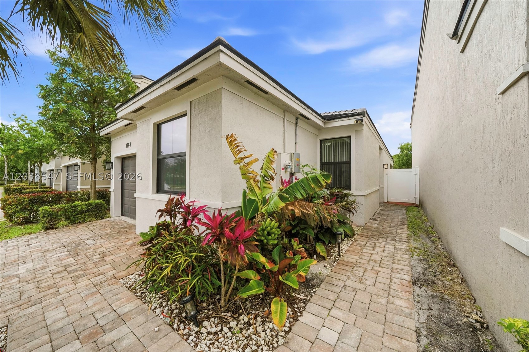 Welcome to this beautifully maintained single-family home located in the gated community of Vantage at Palm-Aire in Pompano Beach. This move-in-ready home features fully paid-off solar panels and a paid-off RainSoft whole-home water filtration system, providing long-term savings and energy efficiency. Home includes refrigerator, stove, microwave, washer, and dryer. The HOA is $430/month and includes water, sewer, cable, internet, landscaping, pool, jacuzzi, children’s playground, and maintenance of all common areas, offering exceptional value and low-maintenance living. Ideally located just minutes from I-95 and the Florida Turnpike with easy access to shopping, dining, parks, schools, and entertainment throughout Broward County. A rare opportunity to own in a secure gated community with strong value, modern efficiency upgrades, and excellent commuter access. Ask about financing options and estimated monthly payment scenarios.