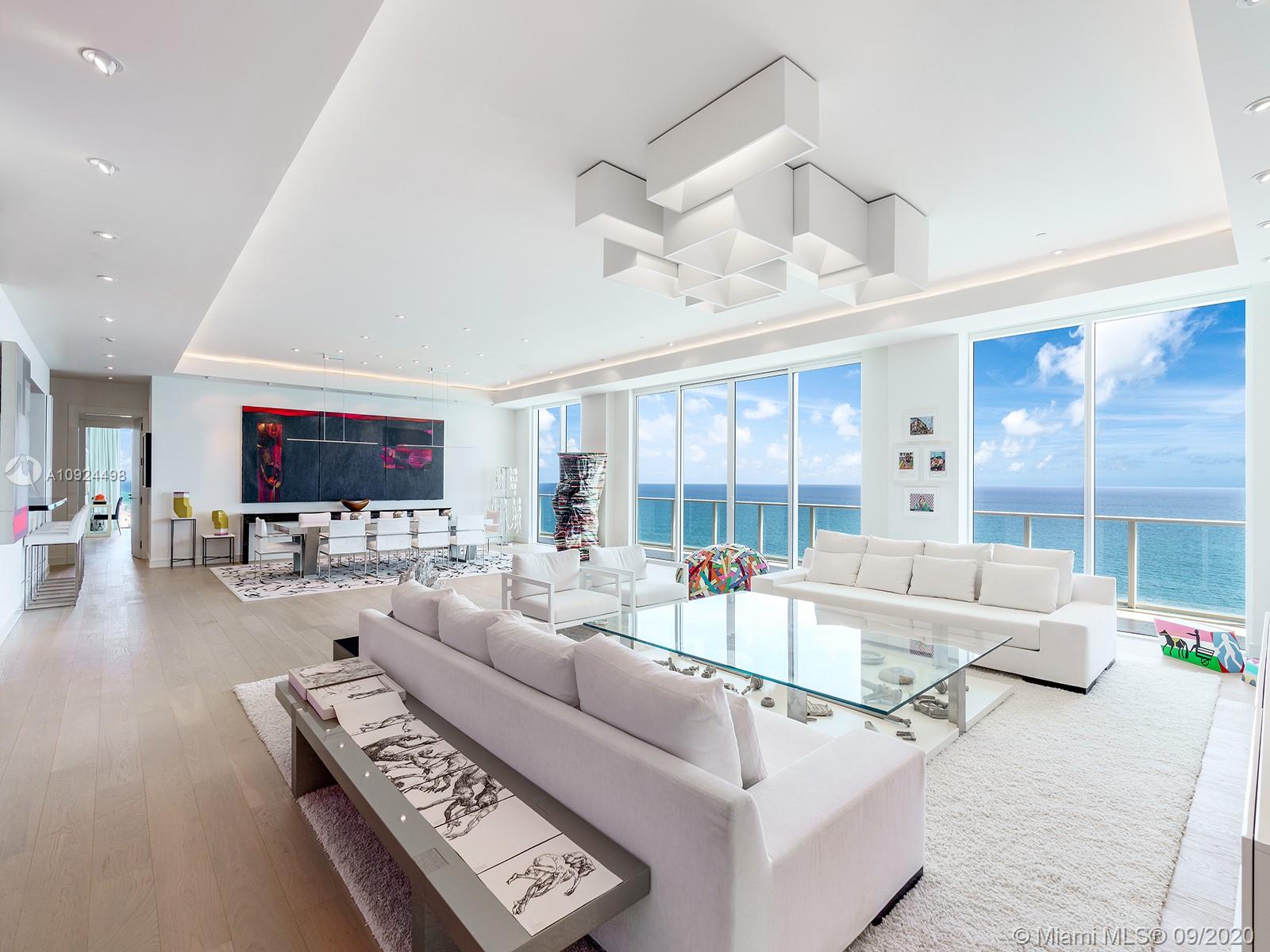 The penthouse at Apogee Beach was completely custom designed to be a luxurious home for entertaining and grand living and is now on the market for the first time. Atop this boutique building designed by renowned architect Carlos Ott, the full-floor residence features extraordinary views in every direction from its many outdoor spaces, including the all-encompassing balconies on the east & west facades, an expansive rooftop deck with outdoor kitchen and private pool, and a private poolside cabana downstairs. Show stopping interiors with high ceilings and pale wood floors, massive living room, and a master suite complete with private office. The building offers an extensive roster of amenities, including over 240ft of ocean frontage, pool, fitness center, club room, theater, and kids lounge.