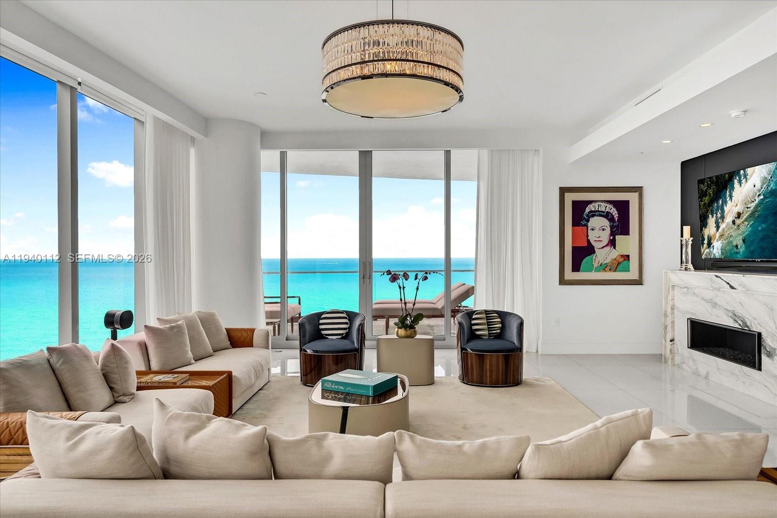 Experience this spectacular four-bedroom corner Ravello residence at The Estates at Acqualina, a masterfully curated home offering over 4,358 square feet of refined interior living space. Thoughtfully designed and impeccably furnished by Luxury Living, every detail reflects an uncompromising standard of elegance, from bespoke finishes and designer furnishings to expansive living areas ideal for both intimate living and grand entertaining. Floor-to-ceiling glass frames breathtaking views while filling the residence with natural light, seamlessly blending indoor and outdoor living in one of South Florida’s most coveted oceanfront addresses.