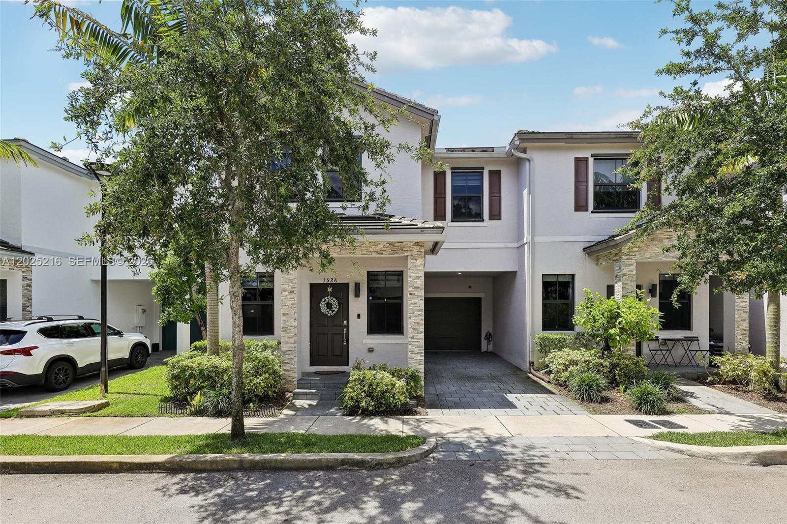 Welcome to the crown jewel of The Edge on 15th, the largest and most desirable corner townhouse in this private gated community, ideally located just minutes from Fort Lauderdale-Hollywood International Airport, downtown Fort Lauderdale, major highways, shopping, dining, and South Florida’s beautiful beaches. Built in 2021, this exceptional 4-bedroom, 2.5-bath residence offers over 1,921 square feet of thoughtfully designed living space, blending modern style with everyday comfort.

As a premium corner unit, the home is flooded with natural light from multiple exposures, creating a bright and airy ambiance throughout. The spacious open-concept floor plan features soaring ceilings, sleek porcelain tile flooring on the main level, and warm laminate flooring upstairs. The contemporary kitchen showcases quartz countertops, stainless steel appliances, and seamless flow into the living and dining areas.

Upstairs, you’ll find four generously sized bedrooms along with a full-size washer and dryer for added convenience. Step outside to your oversized private patio, perfect for entertaining, grilling, or relaxing in your own outdoor retreat. Additional highlights include a one-car garage, driveway parking, ample guest parking, and optional furniture for buyers seeking a move-in-ready opportunity.

Quietly tucked within a peaceful enclave yet close to everything South Florida has to offer, this is more than just a townhouse, it’s a lifestyle.