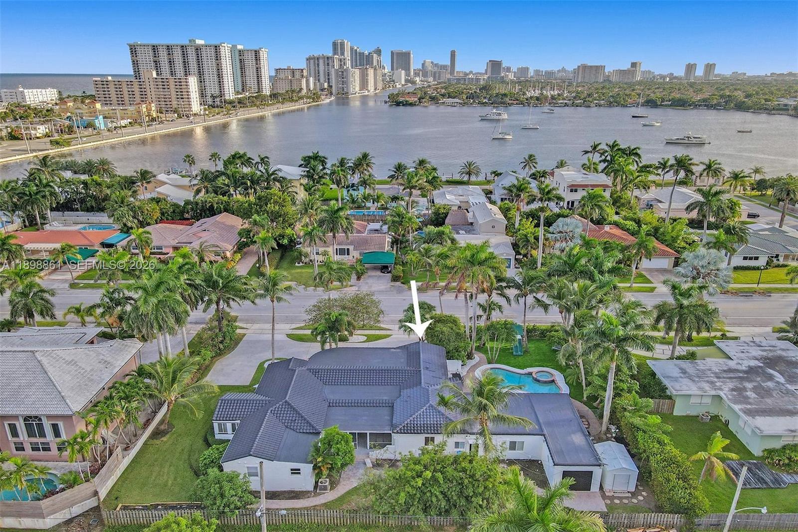 Embrace the best of coastal living in this bright and spacious 7-bedroom, 5-bath home, ideally located just a short walk from Hollywood Beach and the Intracoastal. Set on one of Hollywood’s most desirable streets, this 1953 gem offers 4,197 sq ft of living space on an oversized 18,040 sq ft lot. Inside, enjoy sun-filled interiors, sleek modern bathrooms, warm wood flooring, and a versatile Florida room perfect for relaxing or entertaining. With its generous layout and expansive yard ready for your dream outdoor oasis, this property combines timeless charm, space, and an unbeatable location.