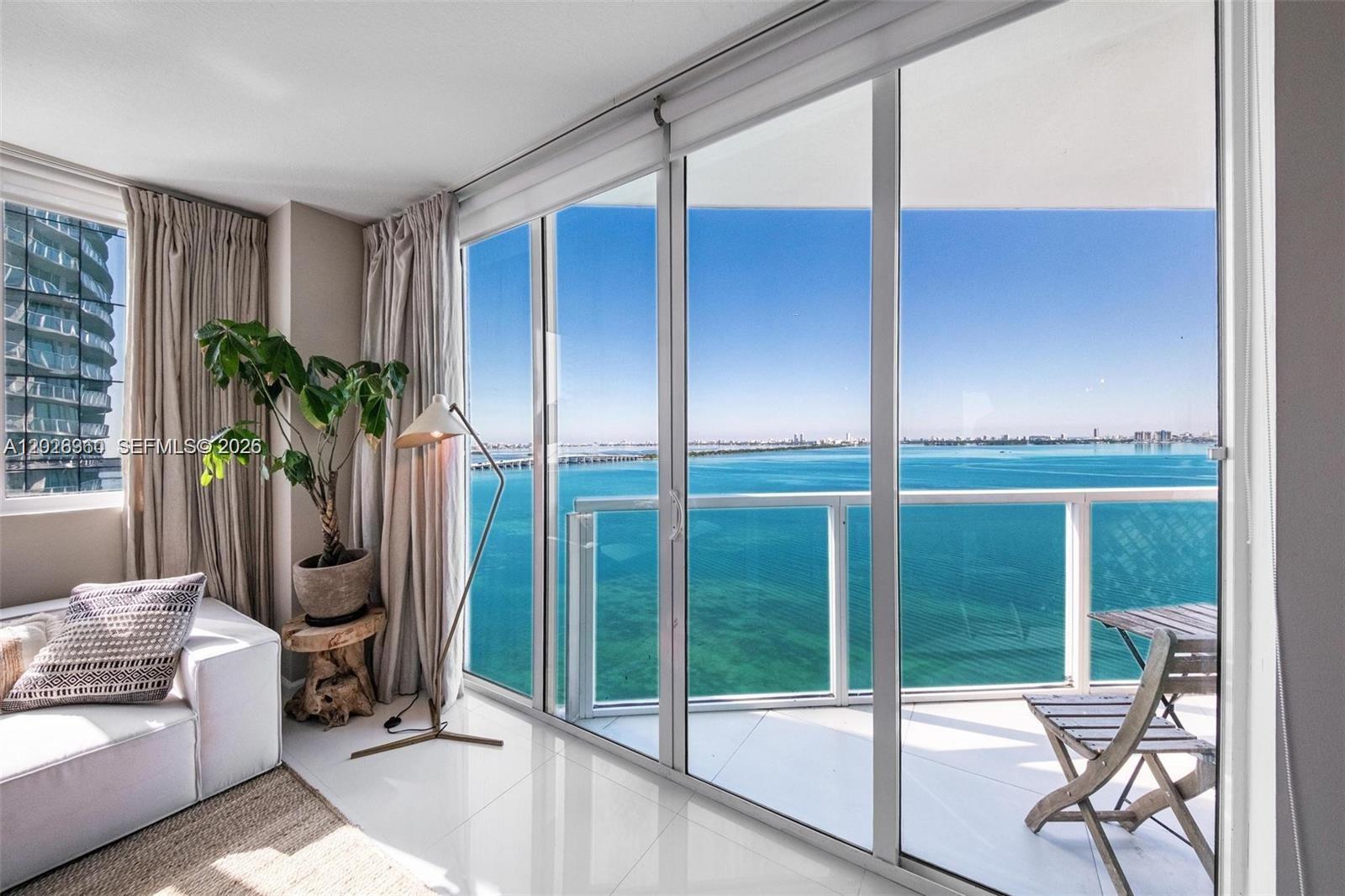 Available for a six-month term! Stunning fully renovated corner residence for LEASE at Onyx on the Bay with direct panoramic views of Biscayne Bay and the Miami skyline. This 2BD/2.5BA, 1,368 SF home showcases a thoughtfully curated design with elevated materials throughout, including a custom waterfall-edge kitchen island, premium cabinetry, designer fixtures, and marble spa-style bathrooms. Smart lighting, refined hardware, and cohesive contemporary finishes create a polished, modern aesthetic. Floor-to-ceiling windows fill the home with natural light, while two private balconies (175 SF total) offer sunrise and sunset over the water. Onyx on the Bay is a boutique luxury building with an infinity-edge pool, spa, sauna, steam room, fitness center, and 24/7 concierge. Edgewater continues to be one of Miami’s fastest-appreciating neighborhoods, surrounded by new luxury developments, waterfront parks, dining, and cultural districts.  Unit is available for occupancy by July 1. Minimum acceptable lease term would be for six months. One-year lease will NOT be possible.