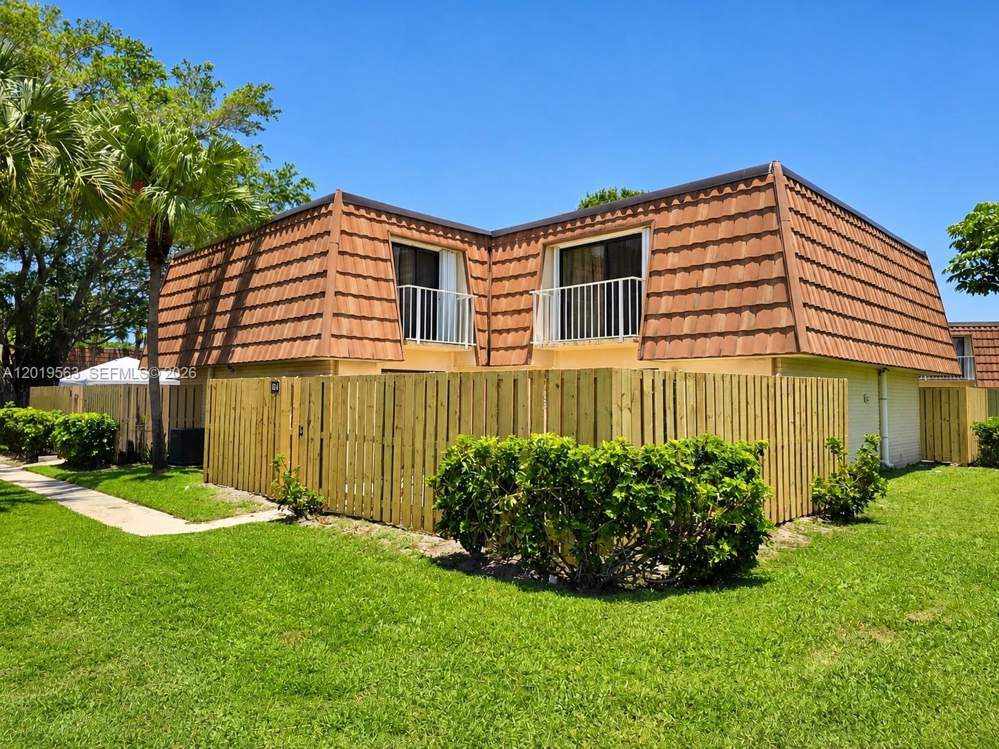 Beautifully renovated 2-bedroom, 2.5-bath townhouse located in the desirable Waterside Luxury Townhomes community in West Palm Beach. This light and bright residence is in immaculate, move-in-ready condition and has been tastefully updated throughout. Features include a modern kitchen with granite countertops, stainless steel appliances, updated flooring downstairs, carpet upstairs, fresh interior paint, stylish lighting fixtures, and in-unit washer & dryer.

Both spacious bedrooms offer private balconies and in-suite full bathrooms, providing comfort and privacy. Enjoy your own fenced private patio, perfect for entertaining, relaxing, or outdoor dining, plus two assigned parking spaces.

Waterside offers resort-style amenities including a swimming pool, tennis courts, fitness center. HOA covers water, sewer, trash, roof maintenance, lawn care, and insurance.

Excellent location just minutes from Palm Beach Outlets, restaurants, downtown West Palm Beach, I-95, and the beaches. A perfect combination of style, comfort, and convenience — this is more than a home, it’s a lifestyle opportunity. Investors are welcome. No rental restrictions.