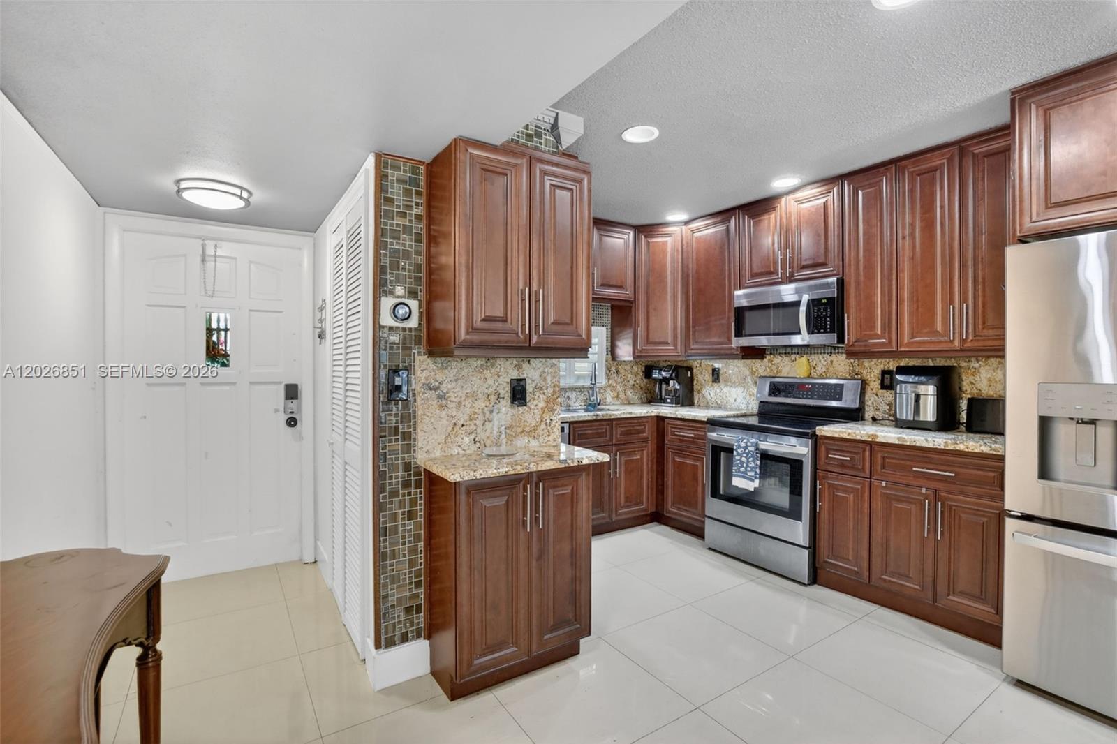 Welcome to Hollybrook Golf & Tennis, a true resort-style retirement community in the heart of Hollywood. This bright and beautifully updated corner unit features impact windows throughout, plantation shutters, and an abundance of natural light. Currently configured as a spacious 1-bedroom with additional living space, this convertible layout can easily be restored to a 2-bedroom floor plan. The fully enclosed patio, also finished with impact windows, creates a wonderful extra space to relax and enjoy the views. The unit also includes one assigned storage unit. Residents of Hollybrook enjoy an impressive list of amenities, including two 18-hole golf courses, a PGA course and Par 3 course, seven pools, 12 tennis courts, six pickleball courts, a clubhouse, restaurant, fitness center, BBQ areas, library, putting green, saunas, shuffleboard, electric vehicle charging stations, vibrant social activities, and 24/7 security. Centrally located in Hollywood and only about 15 minutes from the beach, this is retirement living at its​​‌​​​​‌​‌​​​‌‌​​​‌‌‌​​‌​​‌‌​​​​ finest.
