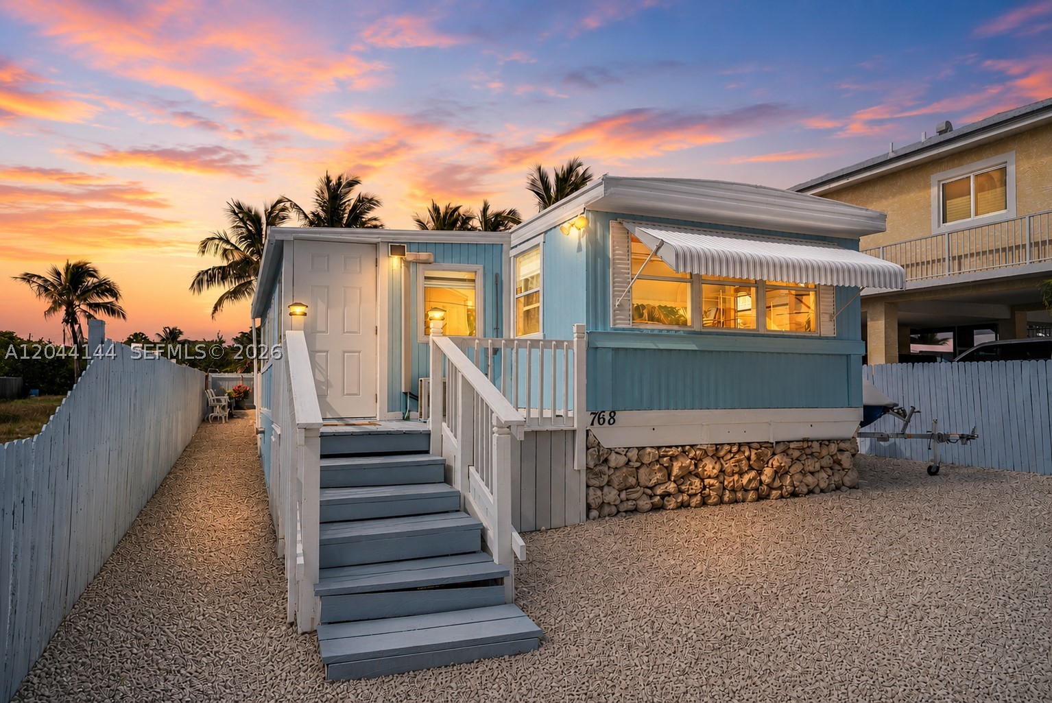 Experience the ultimate tropical getaway in this beautifully renovated 3-bedroom, 1-bathroom mobile home, perfectly situated on a quiet road in a highly desirable Key Largo neighborhood. Offering a seamless blend of modern comfort and relaxed island living, this turnkey property is completely move-in ready. Step inside to find a bright, refreshed interior featuring stylish updates, durable flooring, and an efficient layout that maximizes every inch of living space, making it an ideal choice for a full-time residence, weekend retreat, or rental investment.

One of the standout features of this property is its massive, oversized lot. Premium outdoor space is hard to find in the Keys, and this expansive, fully fenced yard provides a private oasis perfect for outdoor entertainment, pets, or tropical landscaping. Boaters, anglers, and outdoor enthusiasts will especially appreciate the abundant room for secure storage, offering plenty of space to park a large boat, trailer, jet skis, or an RV right on site.

Just minutes away from world-class diving at John Pennekamp Coral Reef State Park, exceptional fishing, local marinas, and iconic waterfront dining. Enjoy the unparalleled convenience of Upper Keys living with an easy commute to the mainland while still being completely immersed in the laid-back island lifestyle. Bring your boat, pack your bags, and start living your Florida Keys dream today.