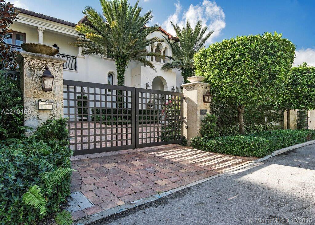 VILLA MAGNOLIA - Rare opportunity for this Bay Harbor Islands waterfront estate w/unobstructed views of wide bay & Indian Creek golf course. Mature landscaping & exterior lighting, expansive back garden for entertaining & 75' heated lap pool. Large dock w /24,000 lb boat lift on deep water w/direct ocean access. Enter through private gates, impact glass throughout, perimeter cameras, alarm system & generator. 7,100 sq. ft under air, incl. guest cottage, 800+ bottle wine cellar, media room & library.