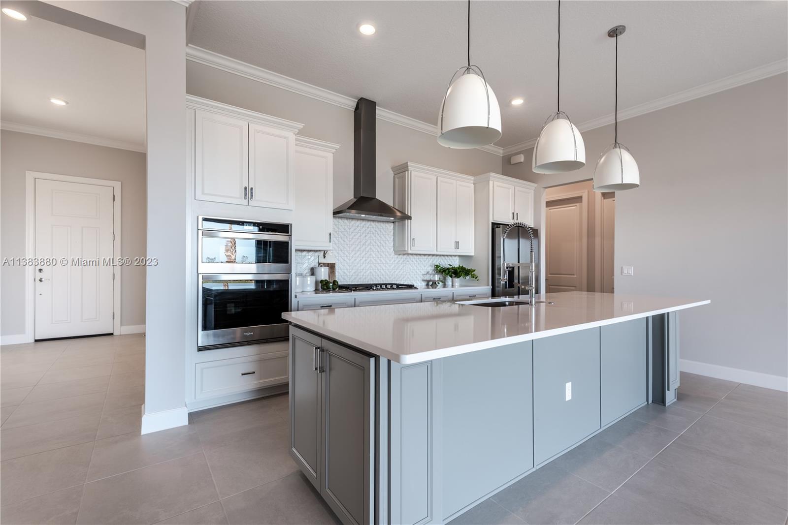 BRAND NEW Highly desirable Ashby model in Veranda Gardens! LOADED w. upgrades! PREMIUM Oversized Corner Lot. This beautiful home has 4 beds, 2.5 bath, 3 car garage, an open-concept floor plan, large Built-In kitchen, Whirlpool stainless steel appliances, 36" cabinets & quartz countertop, cabinet wrap island, & natural gas stove. 12' High ceiling w. 8' interior doors. Hurricane impact windows throughout with Pocket sliding doors in the Living room area. All bathrooms have upgraded cabinets, sinks, shower wall tile to the ceiling, frameless shower doors, Owner's suite w. a TUB. Veranda Gardens has state of the art clubhouse: indoor/outdoor gym, community pool, lap pool, jacuzzi, fire pit, tennis/basketball courts, kids' playground, dog park! Minute to Turnpike and Publix shopping plaza.