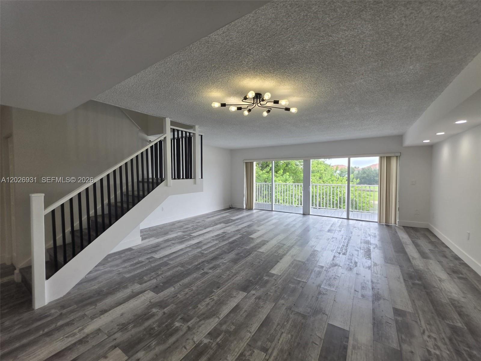 Gorgeous two-story townhouse condo offering serene lake views and daily encounters with nature! This beautifully updated home features a modern open-concept layout. The sleek kitchen boasts stainless steel appliances, complemented by a contemporary in-unit washer and dryer. Relax in the expansive living and dining area, which opens to a private balcony with spectacular waterfront views. Upstairs, you will find three bedrooms and two modern bathrooms, including a massive primary suite that looks directly out over the lake. Truly turn-key and ready for immediate move-in!