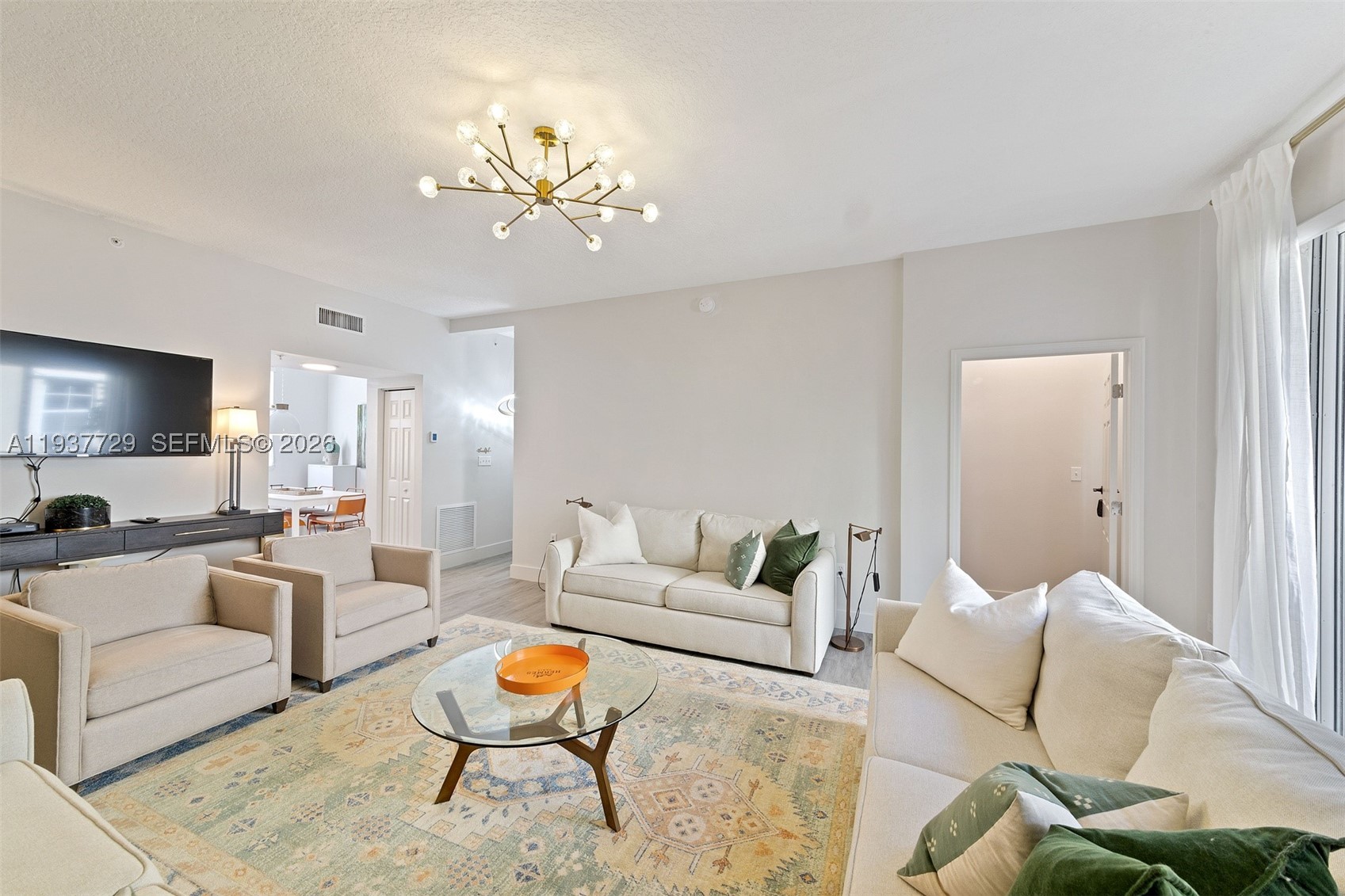 Rare Opportunity in the Heart of Hallandale Beach! Just minutes from the famous Hollywood Boardwalk and Aventura Mall. This 3-bedroom, 3-bath residence includes a 2-car garage with a screened garage door, epoxy flooring and guest parking, plus a newer A/C system.  Designer interiors with three fully renovated suites, open-concept living, a dedicated laundry room, and upgraded features throughout. All assessments have been fully paid. Beyond safety and tranquility, the property offers private beach access with four chairs and an umbrella, two pools, a hot tub, barbecue areas for both the main building and the townhomes, canal access, and an ocean-view gym.  Experience luxury coastal living in South Florida, just moments from shopping, dining, airports and entertainment. Located in a community that allows short-term rentals (30-day min) — perfect for investors or seasonal living.