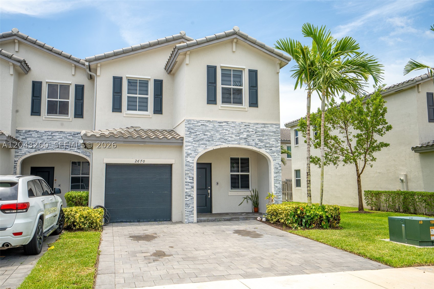 Stunning 2021 Townhome in the Gated Riviera Community of Homestead. Welcome to this beautifully maintained 2021 townhome located in the highly sought-after gated Riviera community in Homestead. This spacious residence offers more than 1,695 square feet of thoughtfully designed living space, featuring 3 bedrooms and 2.5 bathrooms. The open-concept layout is perfect for modern living, showcasing a bright and inviting living area, a contemporary kitchen with stainless steel appliances, and seamless flow for everyday comfort and entertaining. Enjoy the convenience of a one-car garage and relax outdoors on the covered patio. An ideal setting for family gatherings, weekend barbecues, or quiet evenings at home. Residents of Riviera enjoy access to exceptional resort-style amenities, including a clubhouse, swimming pool, and fitness center. Ideally situated just minutes from the Florida Turnpike, shopping, dining, parks, and the gateway to the Florida Keys, this home offers both convenience and lifestyle. Families will appreciate the proximity to highly regarded schools, including Somerset Preparatory Academy Homestead, Keys Gate Charter School, and Keys Gate Charter High School. Come and see this amazing property.