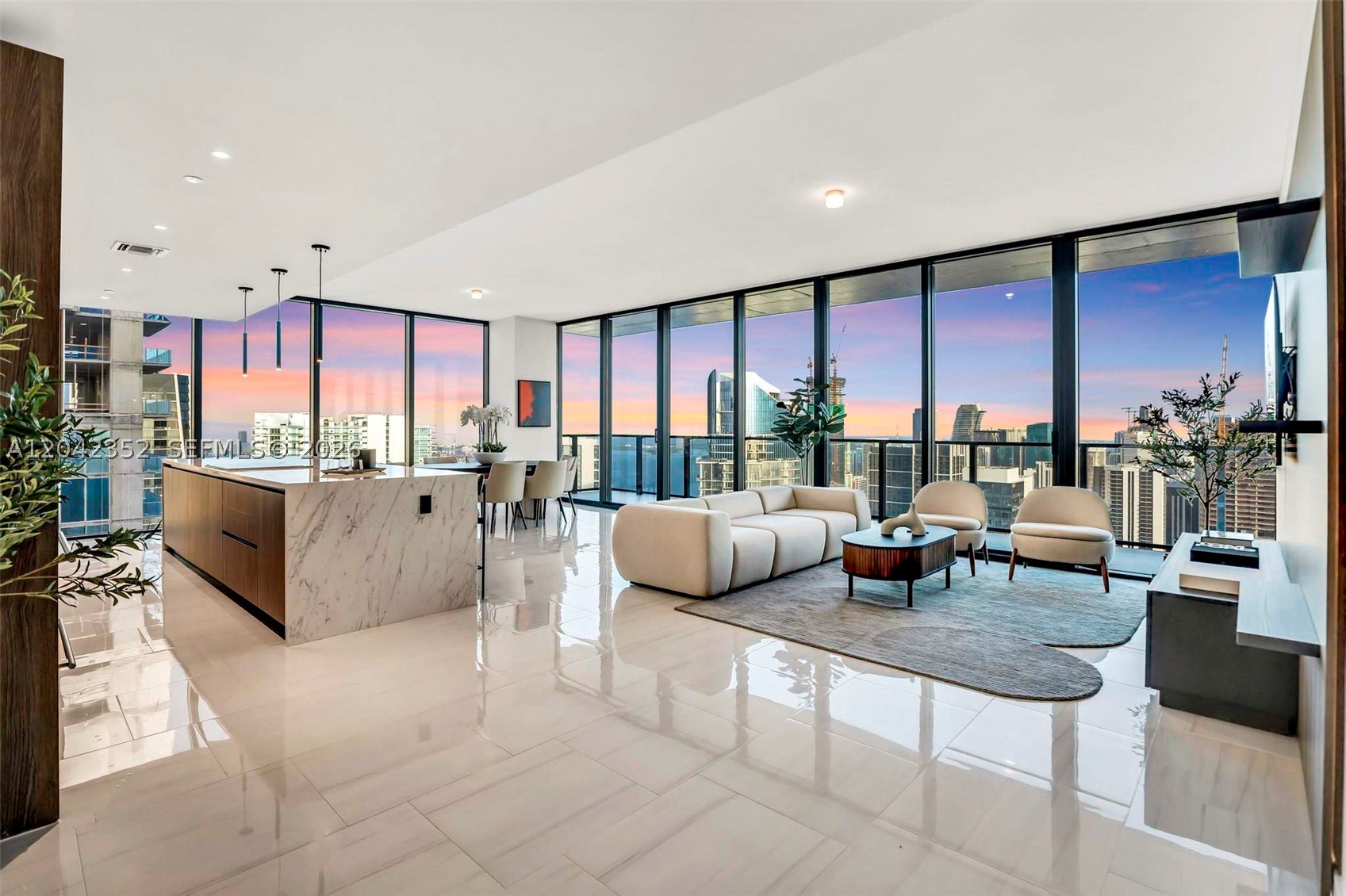 Experience elevated Miami living in Sky Penthouse 6003 at E11EVEN Hotel & Residences. Part of the limited Sky Penthouse Collection, this fully furnished, turnkey 2,693-SF residence offers 4 bedrooms, 4.5 bathrooms, 10-foot ceilings, floor-to-ceiling glass, custom blinds, built-out closets and smart-home technology. AvroKO-designed interiors feature an Italkraft kitchen with Sub-Zero and Wolf appliances and Waterworks-appointed baths. The residence also includes three valet parking spaces and a private office space in Tower 2 upon its completion. Amenities include concierge service, Chopra Spa & Studio, resort pool and day club, rooftop dining, Club E11EVEN, sports lounge and beach club access. Also offered for lease at $45,000 per month.