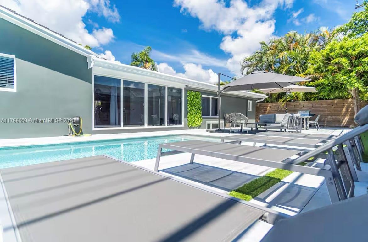 Stunning this beautiful designed 5 bedroom, 4,5 bathroom home ideally located in North Miami, just minutes from the upscale shops and dining of Aventura. This fully furnished residence showcases refined taste and exceptional attention to detail throughout. 
Enjoy spacious, light-filled interiors, a modern kitchen, and a seamless indoor-outdoor flow perfect for entertaining. Step outside to your private oasis featuring a aparkling pool, lush landscaping, and plenty of space to relax.
With parking for up six vehicles, this home offers both luxury and covenience in one South Florida's most sought-after neighborhood. Perfect for families relocated.