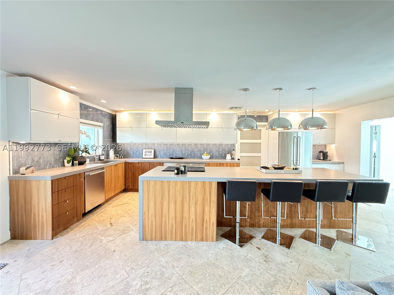 Fully reimagined and impeccably renovated, this 4-bedroom, 2-bath pool home offers 2,098 square feet of sophisticated living on an expansive 0.32-acre lot in sought out Beau Rivage neighborhood. Every detail has been thoughtfully curated, blending timeless design with modern performance. Featuring a brand-new A/C system, full impact windows, metal roof, and spray foam insulation for maximum efficiency and durability. The spacious open layout is ideal for both everyday living and entertaining, with abundant natural light and a seamless flow between living areas. The newly configured 4-bedroom floor plan provides flexibility for families, guests, or a home office setup. Situated on a quiet street and the HOA is voluntary! Ideally located just minutes from downtown Stuart, pristine beaches, and premier dining and shopping, this residence represents a rare opportunity to own a turnkey home where quality, design, and location converge.