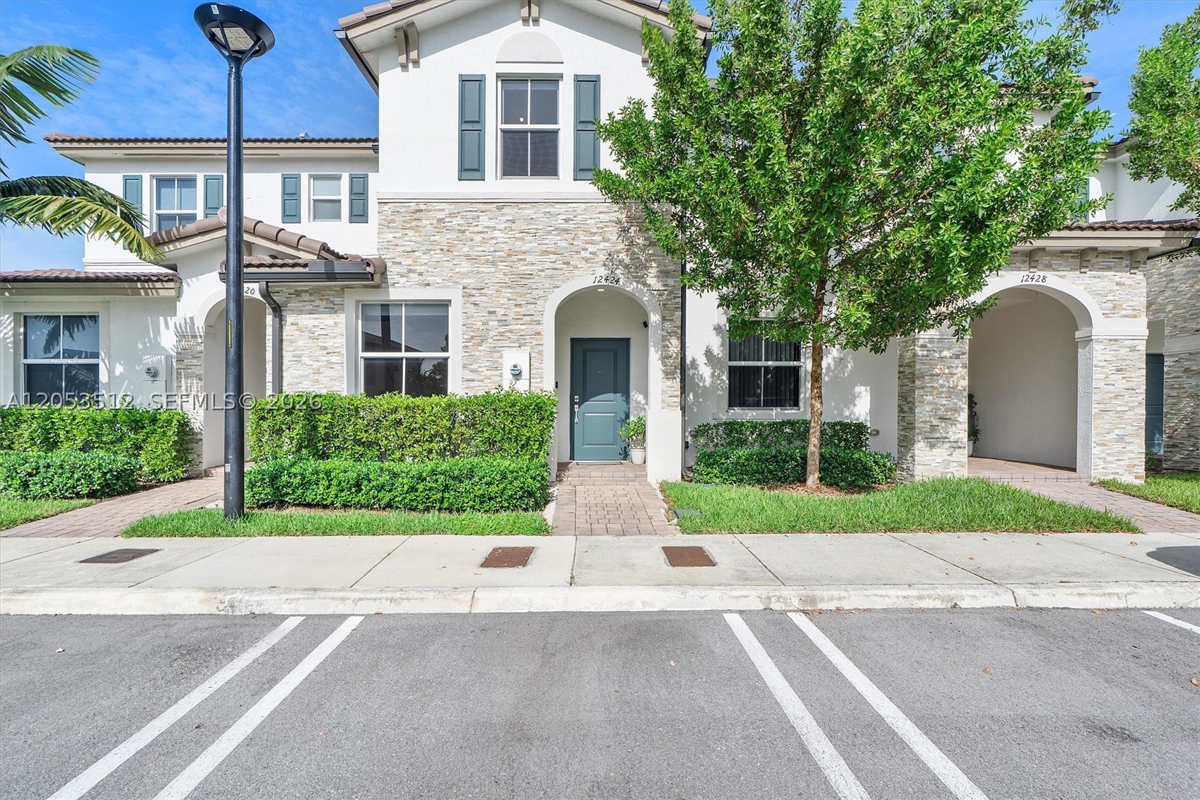 Welcome to this beautifully updated townhome in the guard-gated community of Westview. One of the few residences currently available with a serene lake view, this home offers a rare opportunity to enjoy peaceful outdoor living with a gorgeous private patio overlooking the water.

Featuring 3 spacious bedrooms and 2.5 bathrooms, all bedrooms are conveniently located upstairs, including a stunning primary suite. The residence has been thoughtfully updated throughout with renovated bathrooms, chic finishes, sun-filled interiors, and an inviting open-concept floor plan. Additional features include impact windows, an eat-in kitchen with breakfast bar, and two assigned parking spaces. Laundry in unit.

Enjoy the privacy of your own backyard retreat while taking advantage of the resort-style amenities Westview has to offer, including a luxurious pool, state-of-the-art gym, playground, pet park, and beautifully maintained community spaces. Ideally located near major expressways, just 15 minutes to Downtown Miami/Brickell, 18 minutes to Doral, and 20 minutes to Miami International Airport.