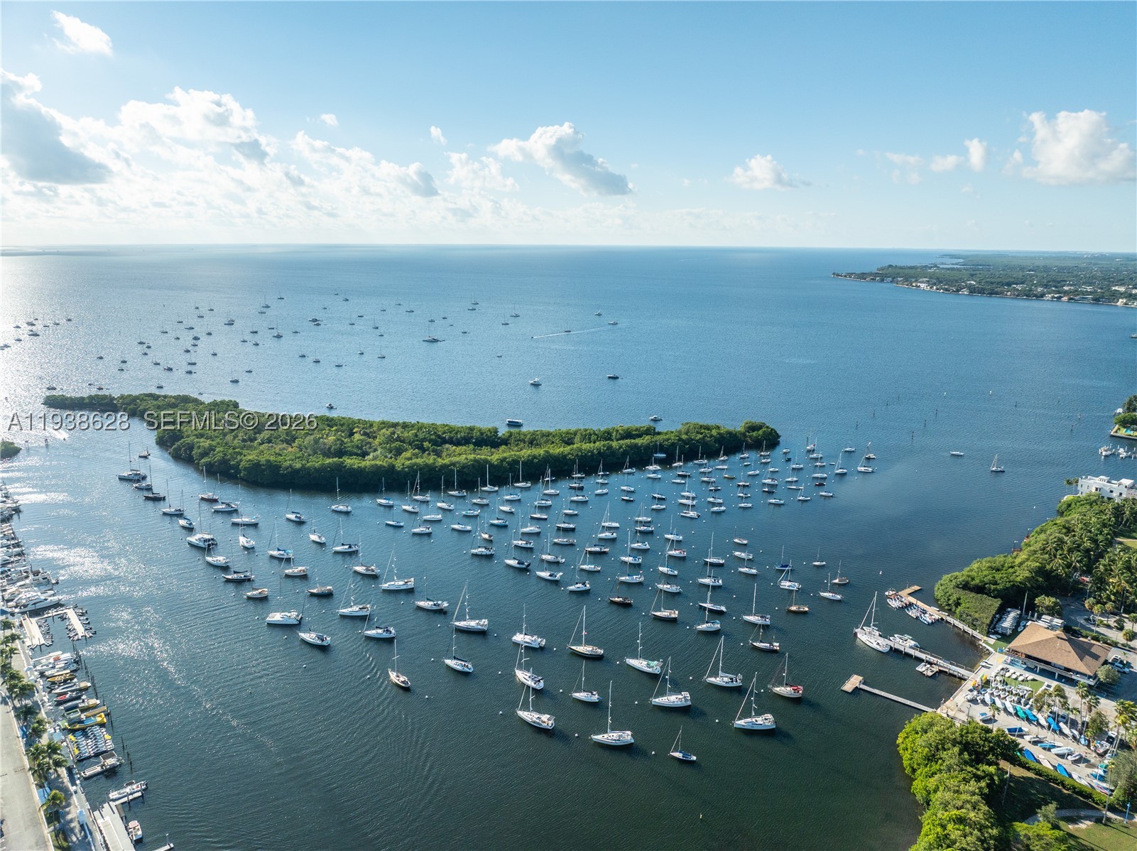 One of the Best Waterfront Opportunities Under $1.5M at Grove Towers, a Rarely available residence in the heart of Center Coconut Grove. This beautifully updated and ready to move-in 2-bedroom, 2-bath home offers effortless living overlooking Biscayne Bay. The light-filled floor plan features Impact Sliding Glass doors and Windows that invite an abundance of natural light and fresh bay breezes throughout the residence. The living areas and guest bedroom open directly to the expansive terrace, creating seamless indoor-outdoor living, while the main suite enjoys its own private waterfront terrace. Wake up to serene water views and enjoy the vibrant Grove lifestyle just steps from your building—Cafés and Restaurants, Coffee Shops, Boutiques, Parks, Marinas, Sailing Clubs, a Movie Theater, Top-Rated Schools, and the relaxed vibe of Coconut Grove’s waterfront living. The building features resort-style amenities, including a heated pool and hot tub, tennis and pickleball courts, EV charging stations, private storage, and monthly social events. Assigned parking space and complimentary valet service complete this exceptional offering.