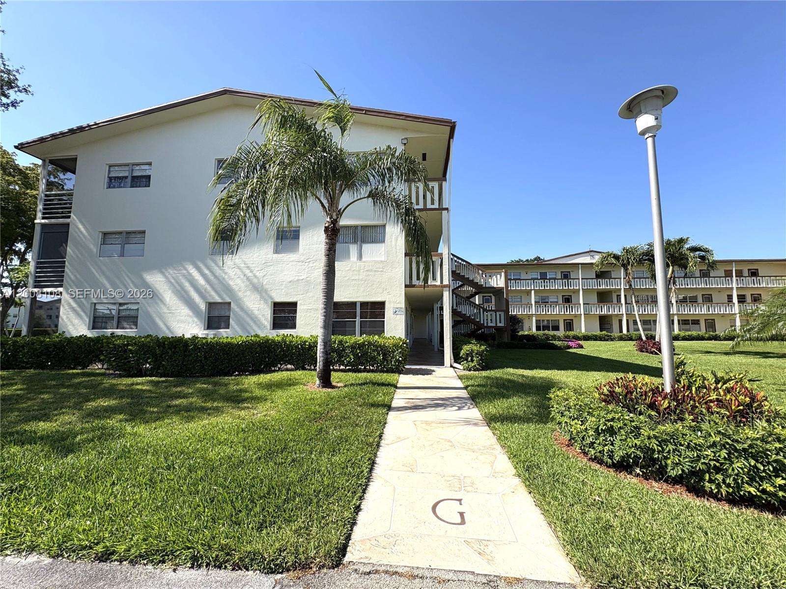 PRICED TO SELL!  Turnkey 1 bedroom / 1.5 bath ground-floor condo with beautiful garden view in Century Village Boca Raton. Prime location just steps from assigned parking spot, community pool and tennis courts! Freshly painted, spotless, and truly move-in ready.  Enjoy 55+ resort-style living in this gated community with 24/7 security, multiple clubhouses, pools, tennis, pickleball, fitness center, theater, endless activities, and two houses of worship. Close to shopping and dining with free community shuttle service.  Maintenance includes water, cable, internet, and security.  Great investment property — can be rented immediately!
