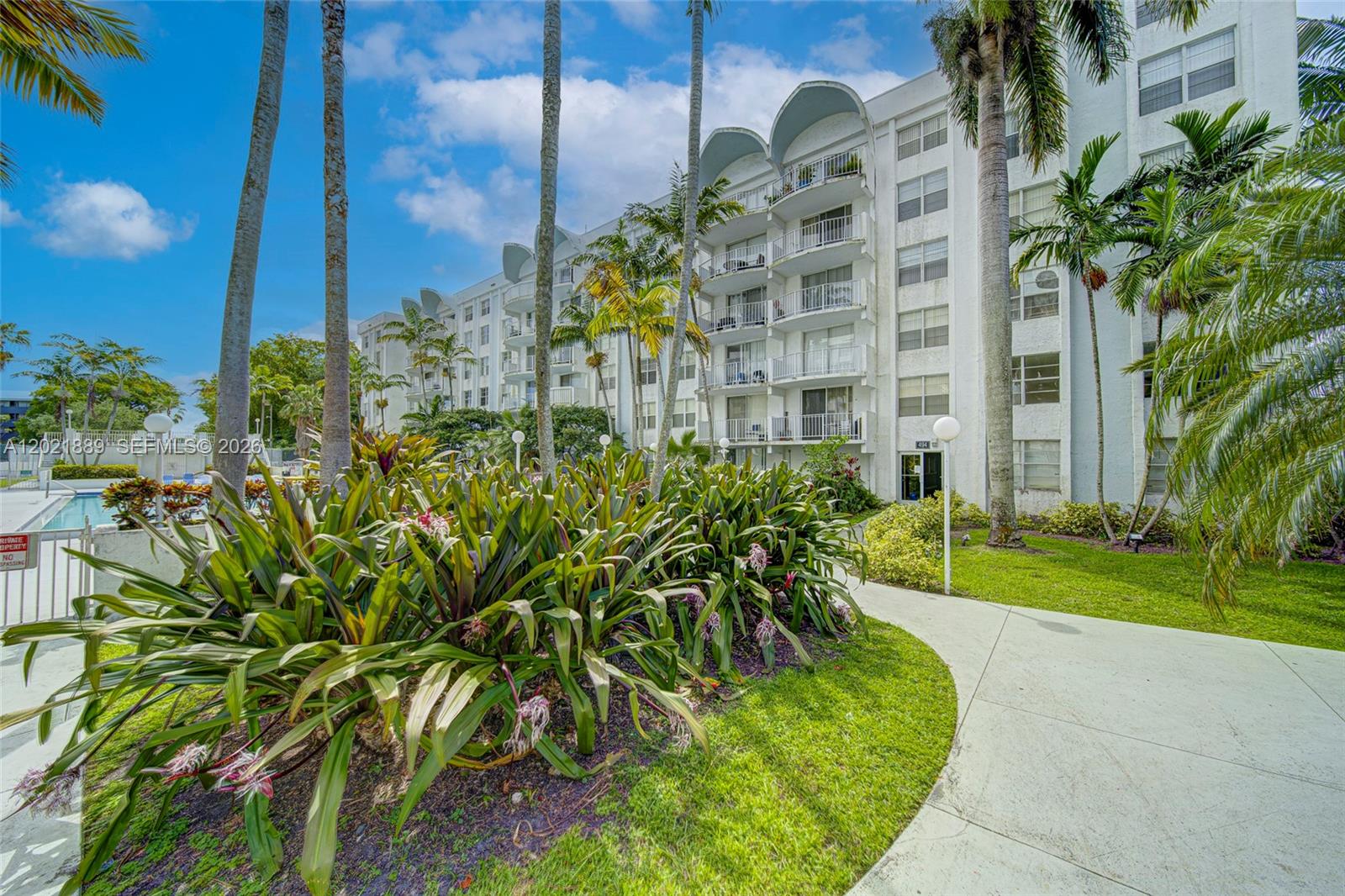 Spacious 2-bedroom, 2-bath apartment in a gated community with 24/7 security. This unit features tile floors throughout, wood kitchen cabinets, granite countertops, generous closet space, and a large private balcony. The community offers on-site management, assigned parking, a pool, exercise room, and laundry facilities on every floor. Conveniently located near major highways, shopping, dining, and everyday services. Pets welcome. YouTube video available by searching the property address.