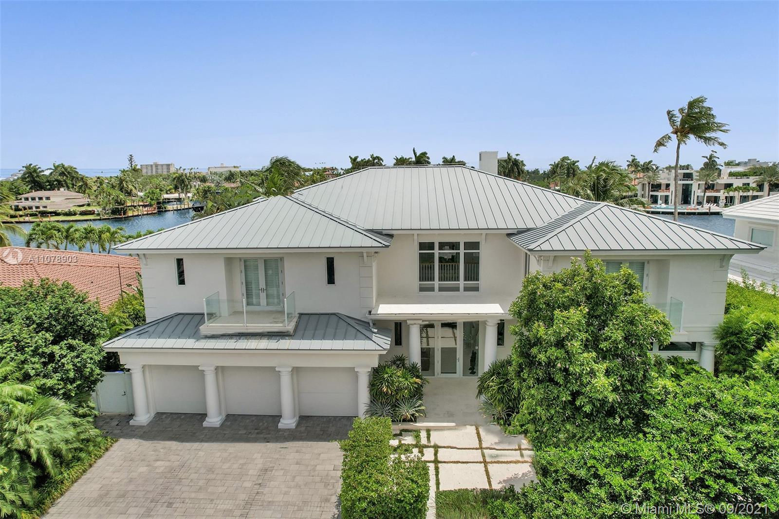 Stunning waterfront estate located in the unique island community of Sunrise Key consisting of 75 single family waterfront homes w/ gated entry & police patrol. Breathtaking wide water views ideal for boating w/ a large turning basin in the no wake zone Rio Barcelona waterway & minutes to the Intracoastal w/ no fixed bridges. Luxurious custom appointments w/ modern framework including all en-suite bedrooms, chef's kitchen w/ butler's pantry, top of the line appliances w/ custom commercial range hood, floor to ceiling windows w/ electric window treatments, tray ceilings, custom oak built-ins throughout, oversized laundry room, 3 car garage, back staircase to 2nd floor, lush landscaping & many more custom features.  First time on the market. Property is offered furnished. Artwork negotiable.