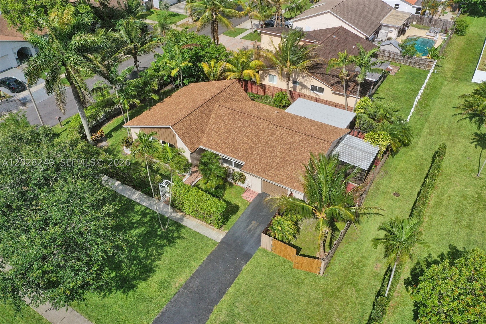 Enjoy South Florida living at this beautifully updated 3-bedroom, 2-bath home which has all the major improvements already completed, including a new 2025 roof, impact windows and doors, and a 2024 A/C system.
Inside, dramatic vaulted ceilings and a freshly painted crisp white interior create a bright, open, and inviting atmosphere. The flexible Family Room, equipped with its own separate A/C, is ideal as a home office, media room, guest suite, gym, or creative space.
Situated on a wide corner lot adjacent to a peaceful linear park, this property offers added privacy and room to spread out. Oversized garage provides valuable space for car, storage, or workshop. Smart-home features add convenience and security.
Screened patio and large fenced backyard with plenty of room for a pool. The side yard offers plenty of space for boat or RV parking, while the newly installed double gate provides added privacy and security.
Perfectly located just 1.1 miles from the beach, 2 miles from Fort Lauderdale-Hollywood International Airport, and minutes from Dania Pointe, shopping, dining, entertainment, parks, and nature preserves. Whether you're looking for a primary residence, vacation home, or investment property, this home combines location, flexibility, and major value in one exceptional price.