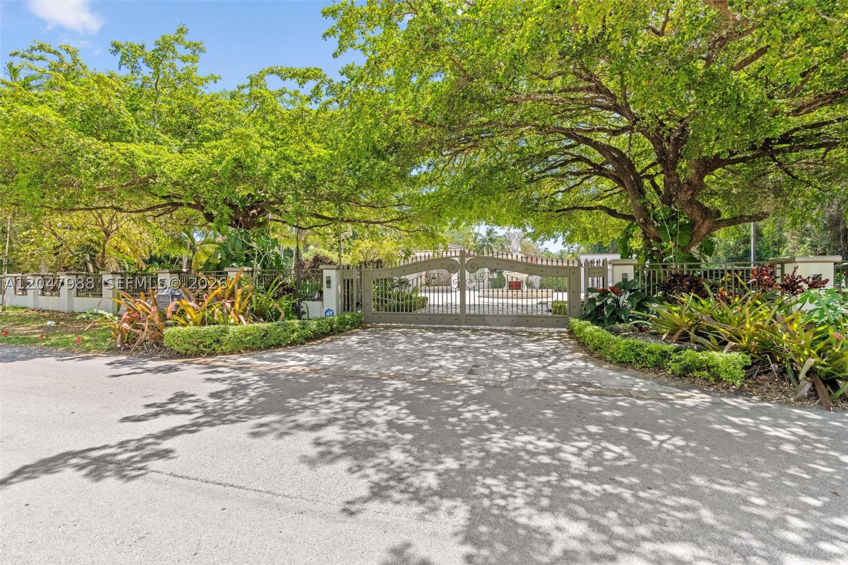 Experience modern luxury in this stunning Pinecrest estate, privately situated on a sprawling one-acre lot along a quiet, tree-lined street. Completely reimagined with exceptional craftsmanship and contemporary design, this residence offers the perfect blend of sophistication, comfort & resort-style living. Thoughtfully renovated with premium finishes throughout, the home features expansive living spaces bathed in natural light, floor-to-ceiling commercial-grade impact glass& seamless indoor-outdoor integration. At the heart of the home, a sleek designer kitchen opens effortlessly to the main living &entertaining areas, all overlooking the spectacular glass-tile pool &lush private grounds. Designed for both relaxation& entertaining, the residence boasts an extraordinary custom home theater, delivering a true cinematic experience without ever leaving home. The thoughtfully designed floor plan includes luxurious primary suite, offering spa-inspired bathroom& generous custom closets, along with two additional guest bedrooms for family and visitors. The gated property offers exceptional privacy&security, complemented by a two-car garage and expansive grounds with endless possibilities for outdoor enjoyment. Surrounded by mature landscaping & located within minutes of Pinecrest's top-rated schools, parks, fine dining, and premier shopping, this is a rare opportunity to own a turnkey estate in one of South Florida's most prestigious neighborhoods. AVAILABLE FOR SALE TOO