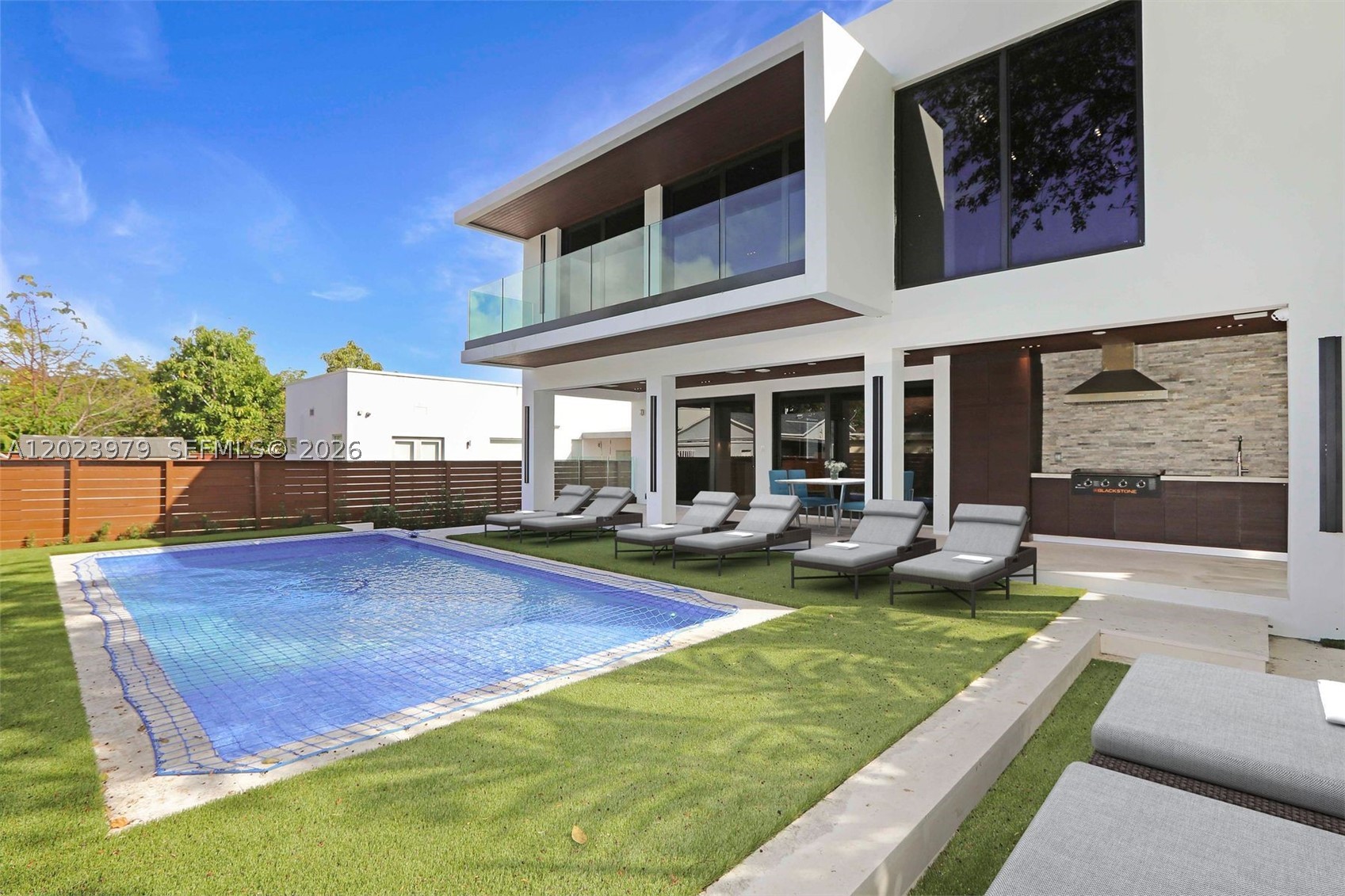 Brand new modern masterpiece in the highly sought after neighborhood "The Roads", steps away from Miami's best shopping, restaurants and schools. Pull into your gated Driveway featuring recessed inground lighting, surrounded by a lush garden & secured Space for up-to 4 cars plus a 1 car garage. Enter through a grand pivot door into an open layout with impeccable attention to detail, this two story home spans 3,500 sqft with 4 bedrooms & 5 full bathrooms. Built with trimless doors & recessed linear lighting for a seamless look throughout the home. Beautifully designed kitchen with top end Bosch appliances & custom wet bar perfect for entertaining. All ensuite bedrooms with built out closets & luxurious bathrooms, featuring Brizo hardware & custom vanities. Expansive Master bedroom offers a private balcony, and spacious bathroom with dual showers and roman tub.  Spacious terrace with built out summer Kitchen, pool & full cabana bathroom. Full security system installed. Enjoy the best of city living with the comfort and ease of a more relaxed setting.