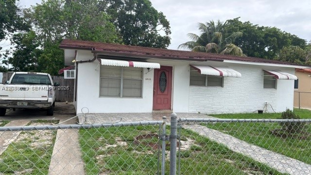 Solid investment or starter-home opportunity on a sizeable lot in Miramar! Fenced yard with mature mango trees and generous front yard space. Open-concept living/dining area, central A/C, original 2004 features throughout. Enclosed back patio addition present — buyer to verify permit status. Roof is currently tarped due to leaks; no roof repairs will be made by seller. Sold strictly AS-IS — highly motivated seller, bring all offers. Buyer/buyer's agent to independently verify all information including square footage, permits, and condition.
